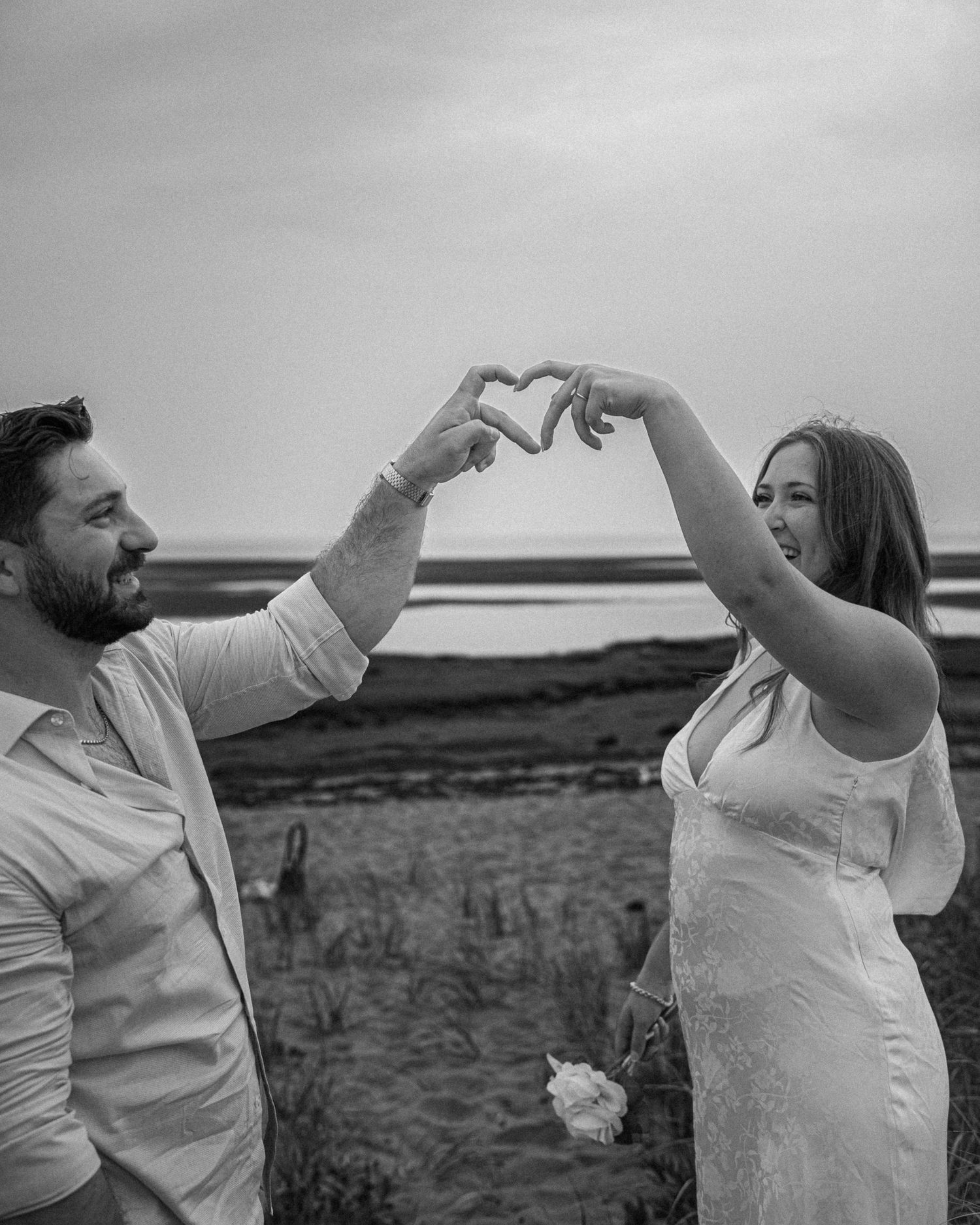 Romantic couple proposal during a golden hour engagement session in beach in Moncton, NB.
