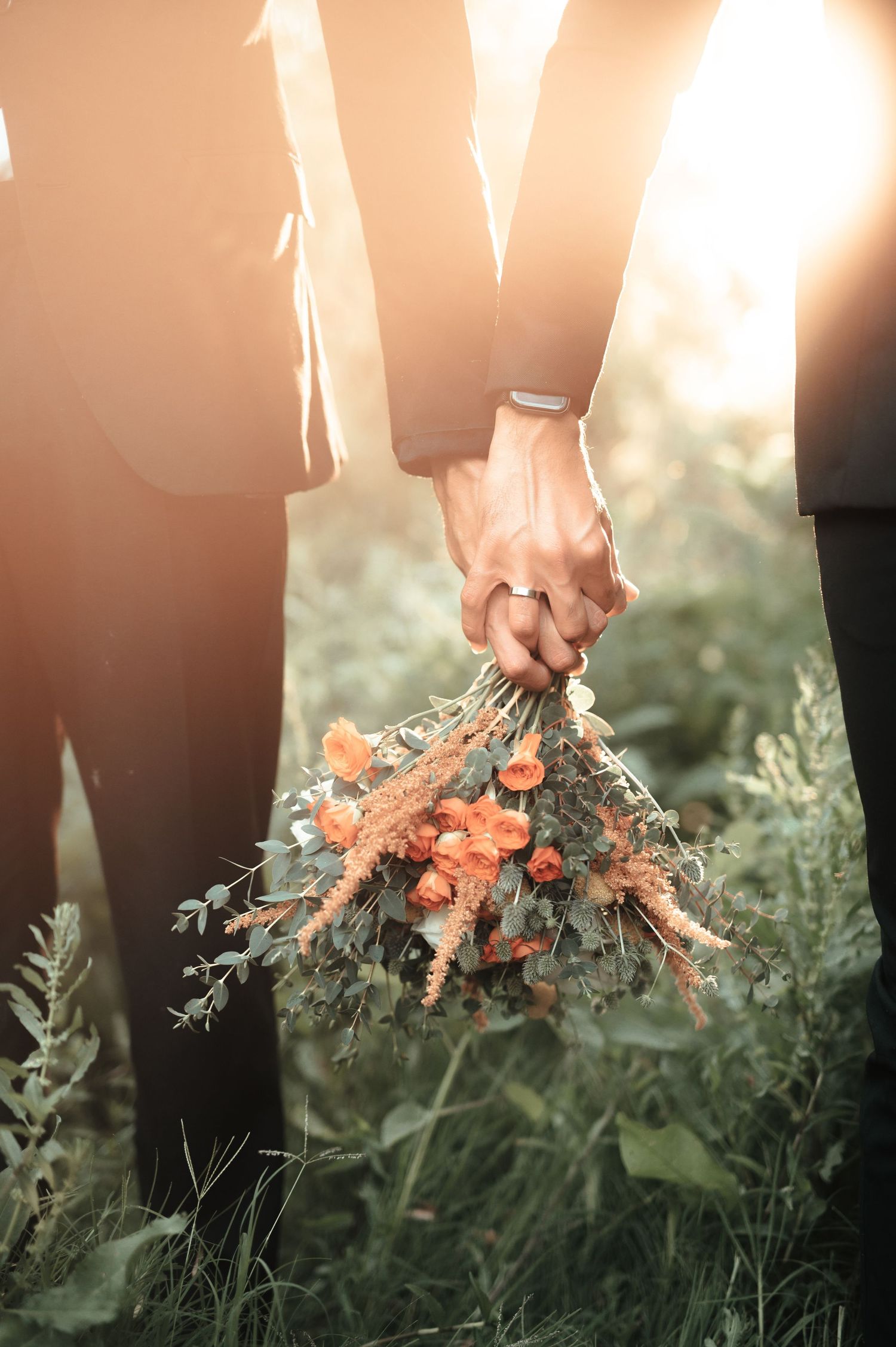 Same sex male couple gay holding bouquet