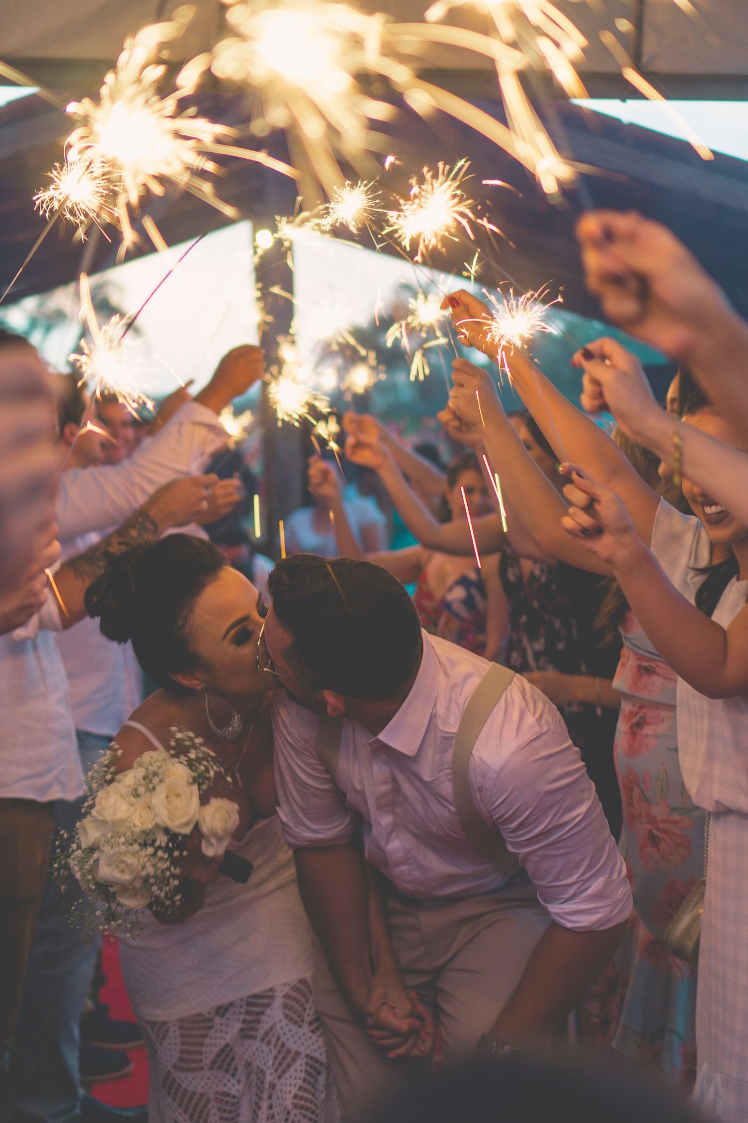 Couple walking through sparklers