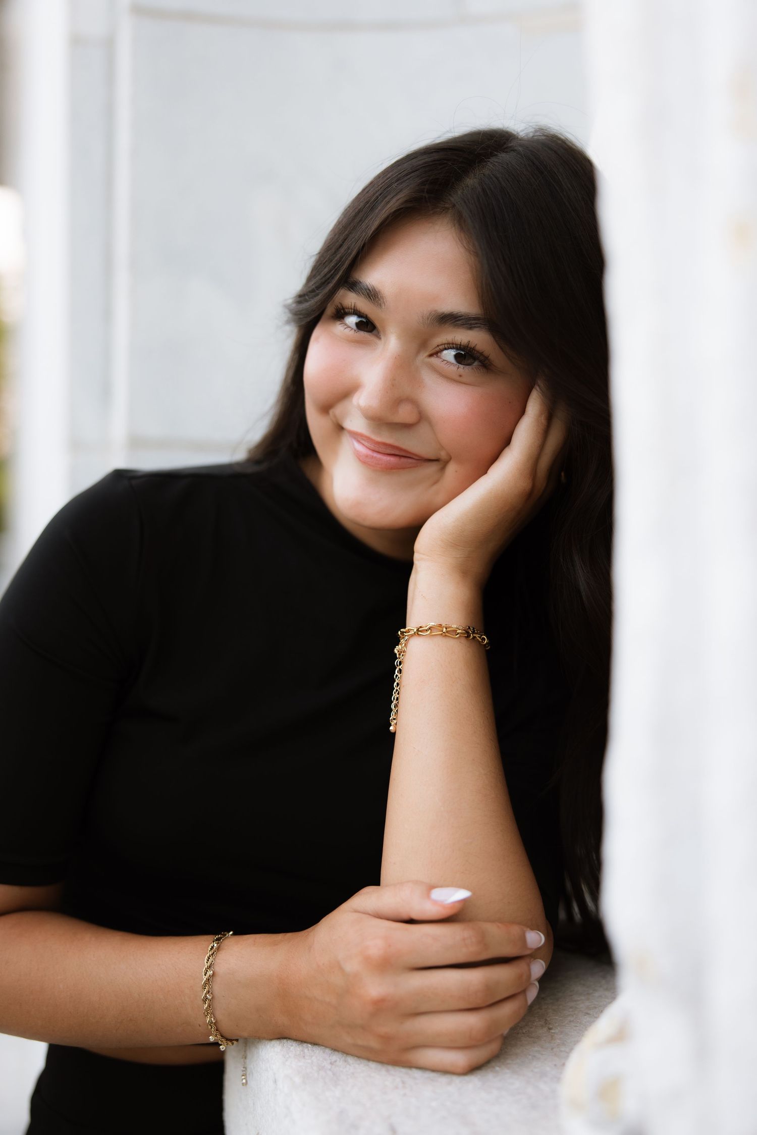 A series of four portrait photos showing someone posing playfully with different expressions against a bright background.