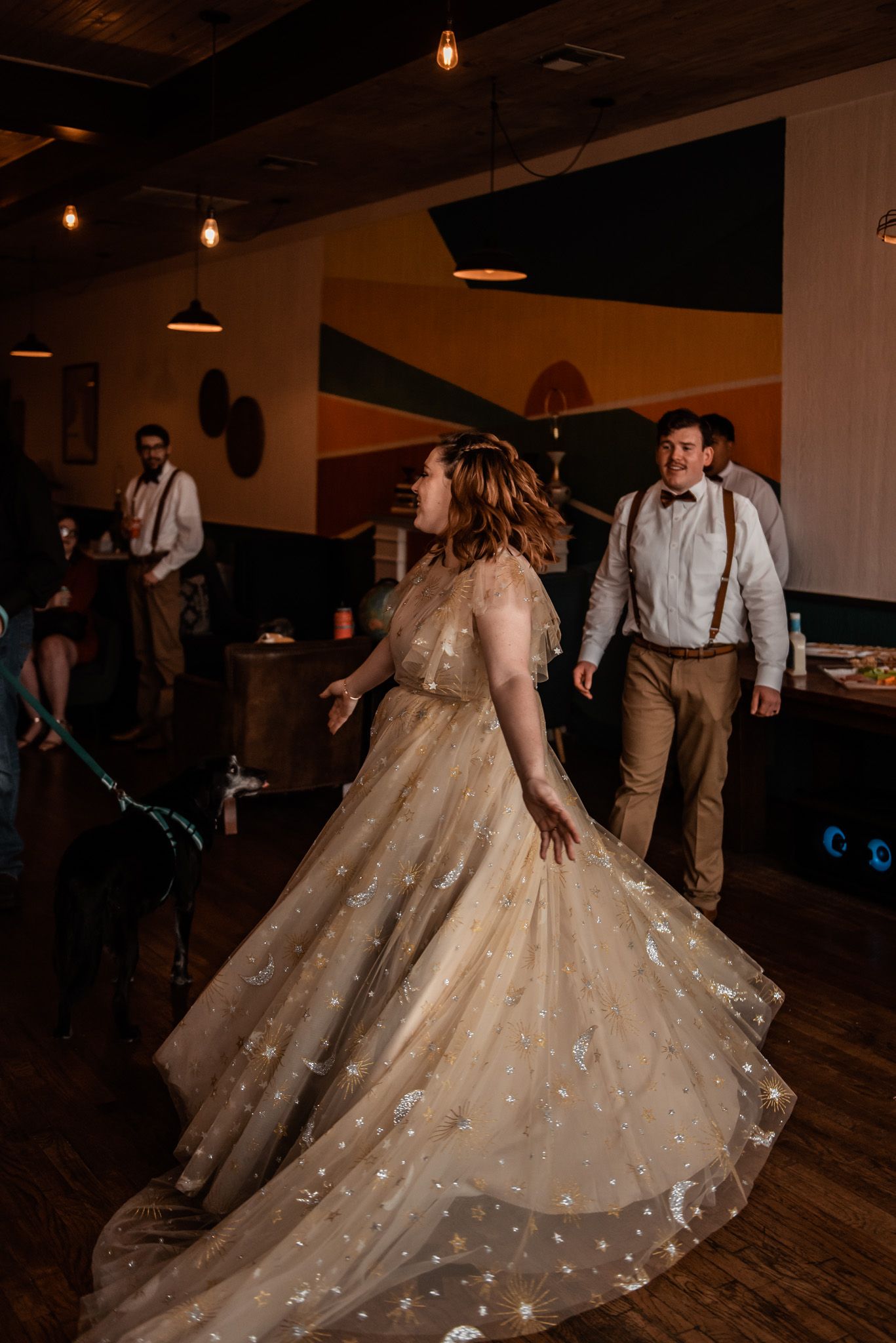 A twirling bride in a long tan celestial dressed photographed by Natalie Marie Photography of Pittsburg TX.