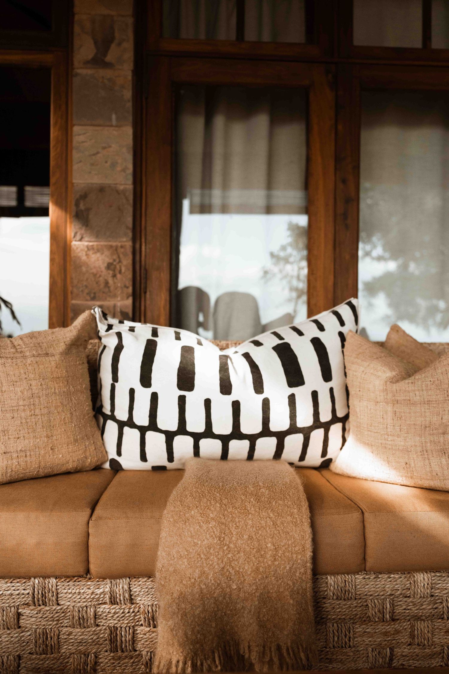 Luxury safari lodge photography in Tanzania highlighting authentic African interior design and guest experience by Black Earth Production.