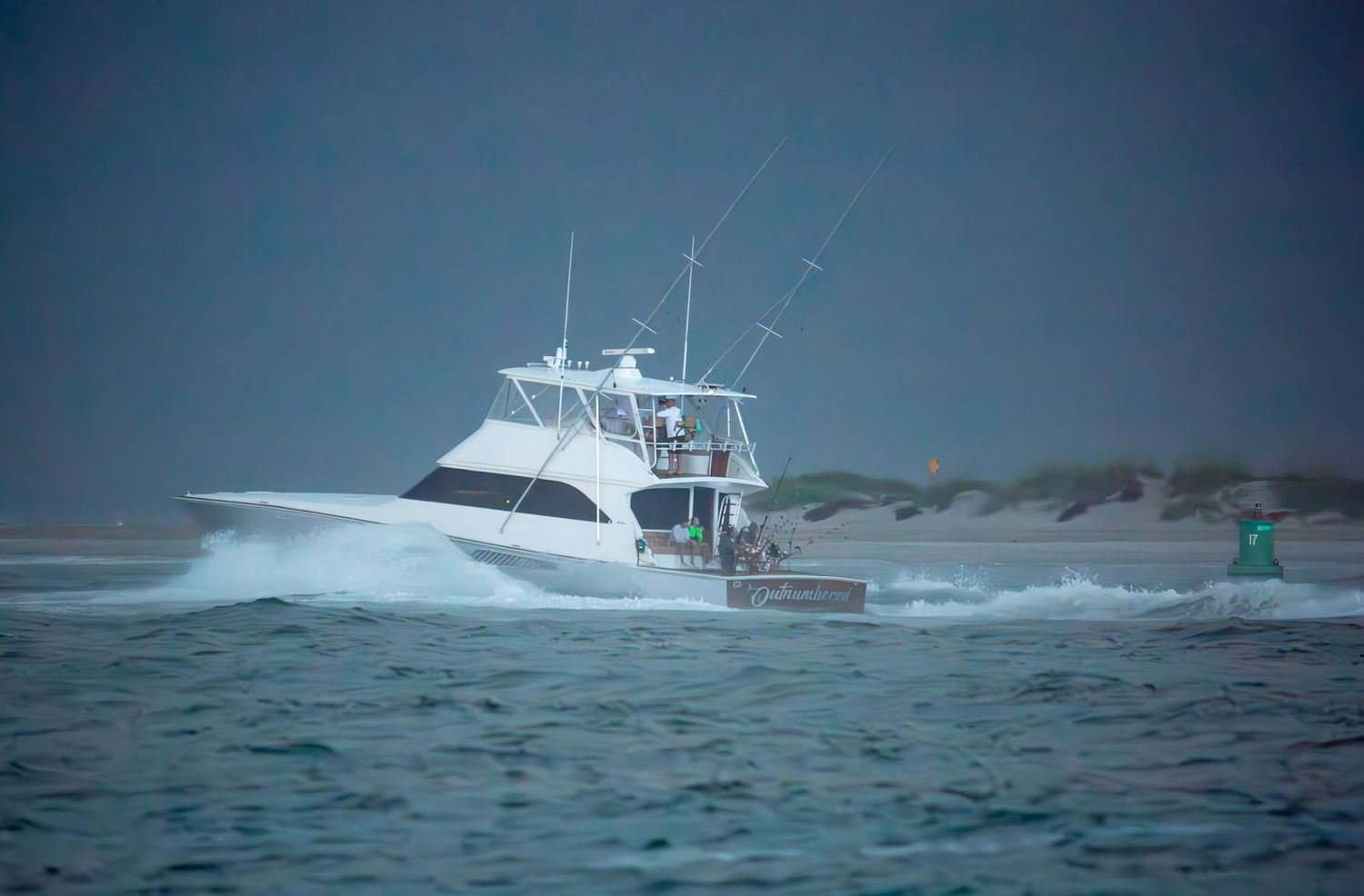Charter fishing boats cruising through dark ocean waters with waves crashing around them.