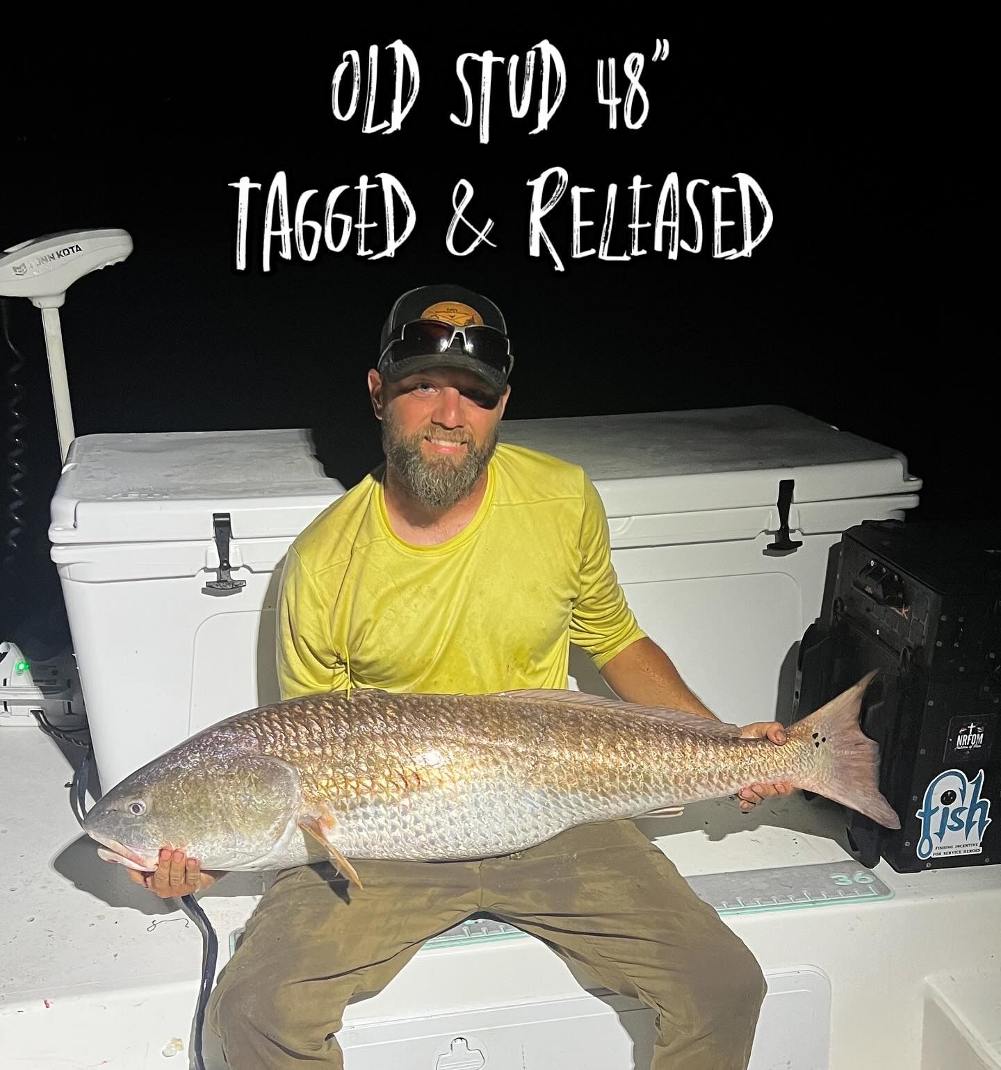 Nighttime photos showing impressive redfish catches on boat deck.