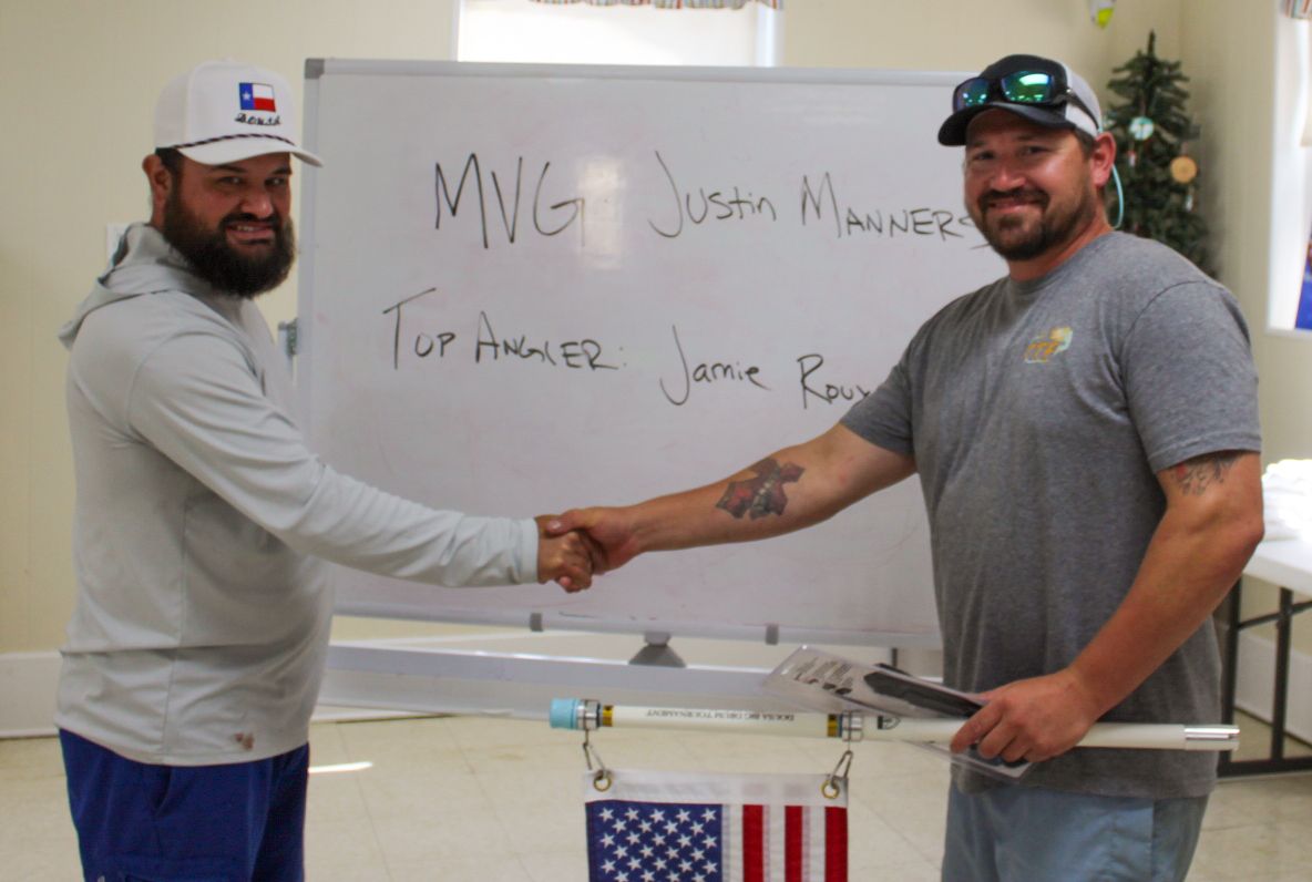Interior of a classroom with whiteboards and American flag visible.