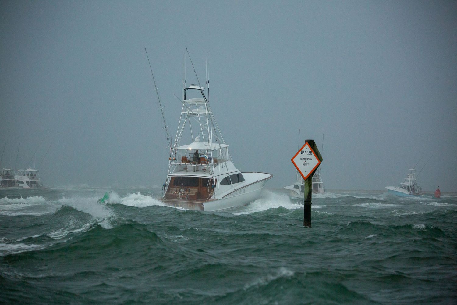 Fishing vessel pitches and rolls while crossing through choppy seas.