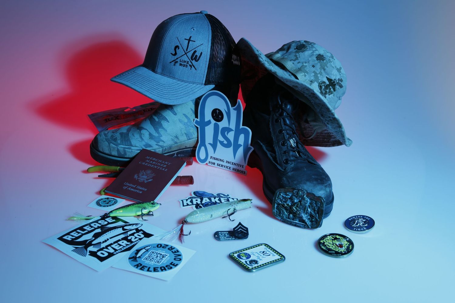 Fishing gear and branded merchandise arranged under dramatic colored lighting.