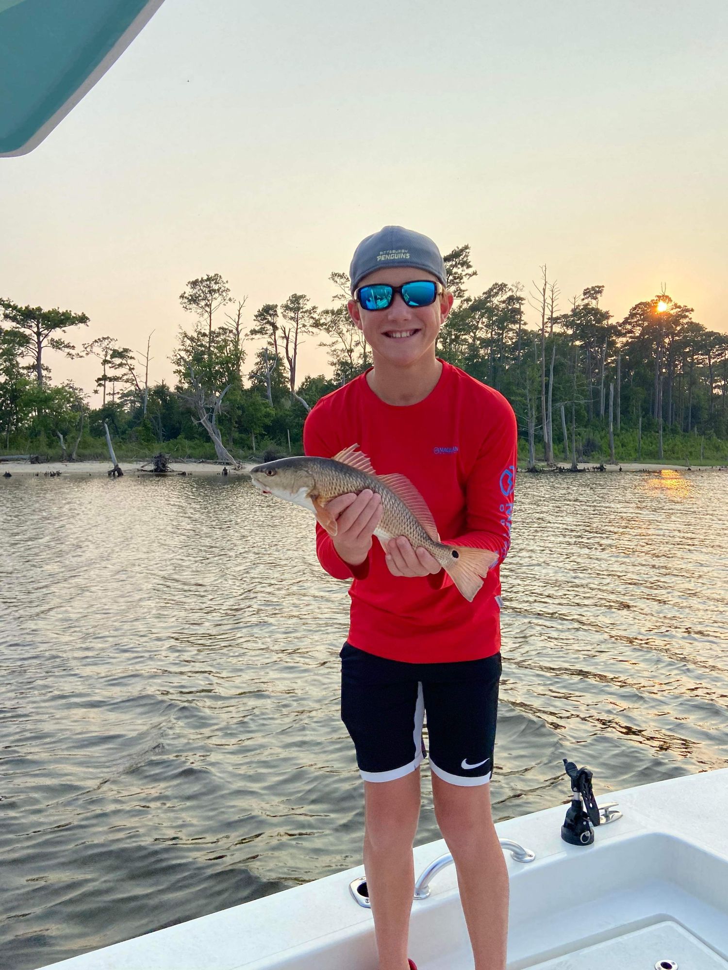 Sunset fishing photos showing various catches on boat deck with coastal trees in background.