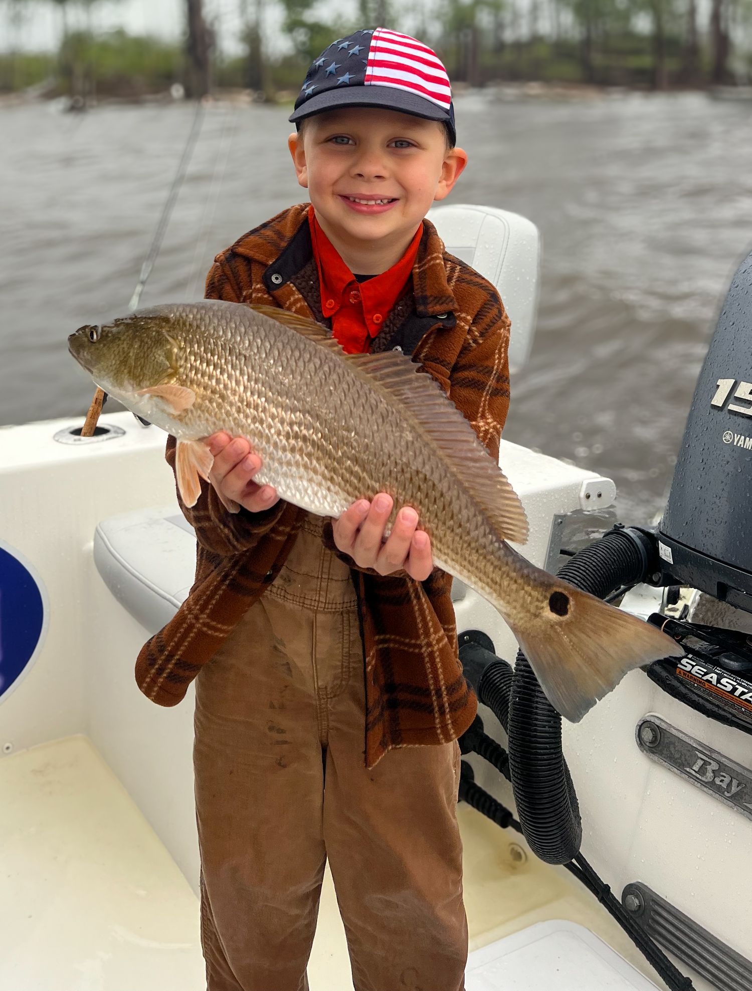 Multiple shots showing redfish catches during a boat fishing trip.