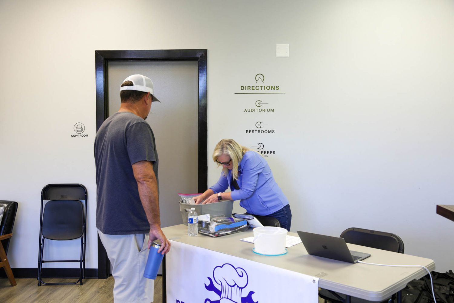 Registration desk setup at a fishing tournament check-in area.
