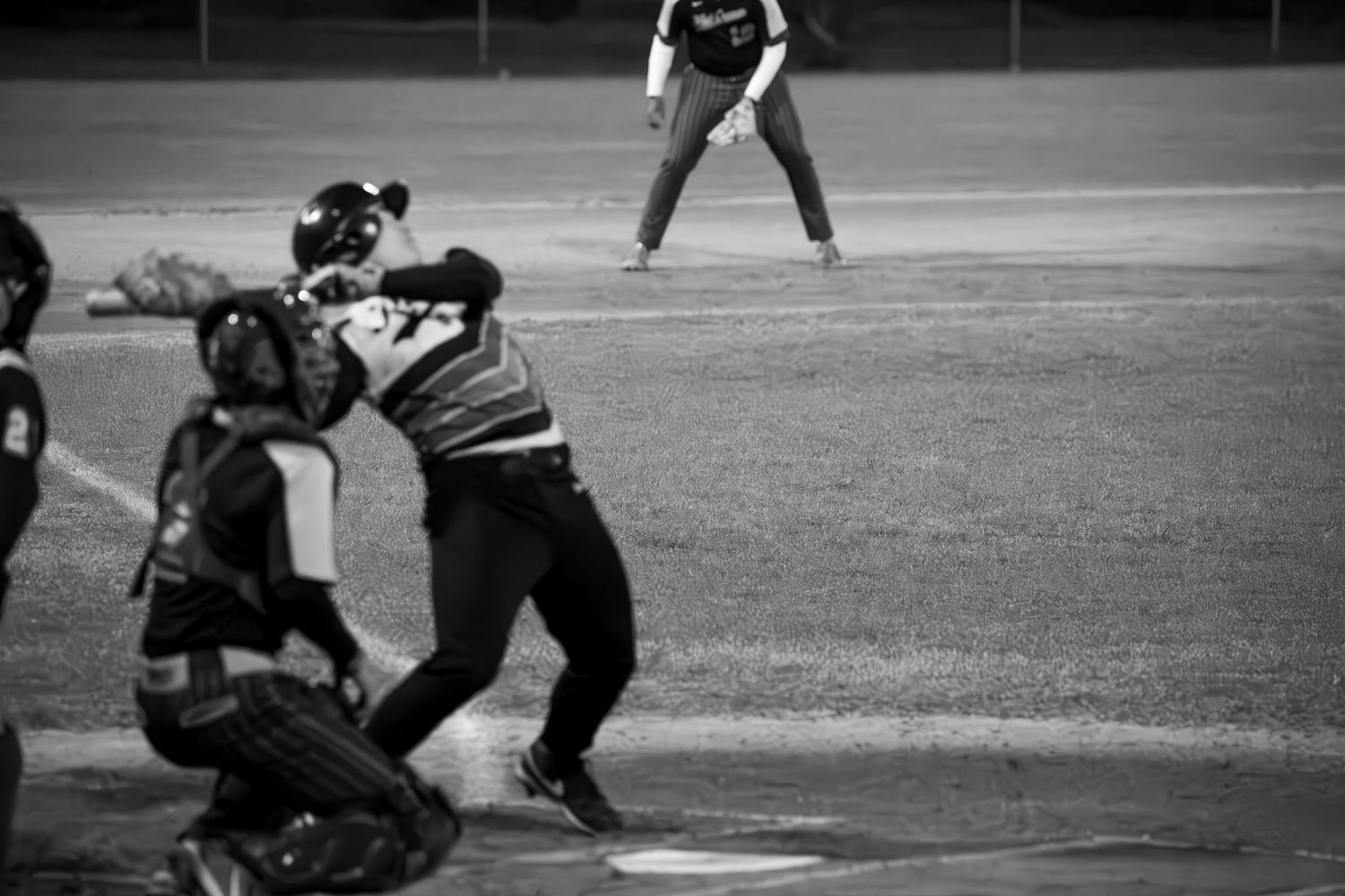 Baseball players in action during game on diamond.
