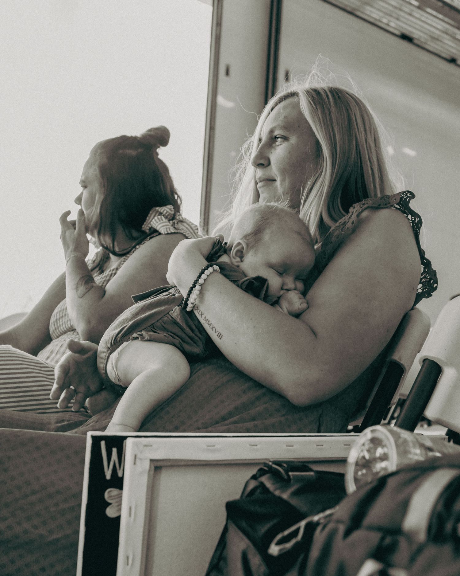 Series of intimate black and white photographs showing tender moments of physical affection and connection.