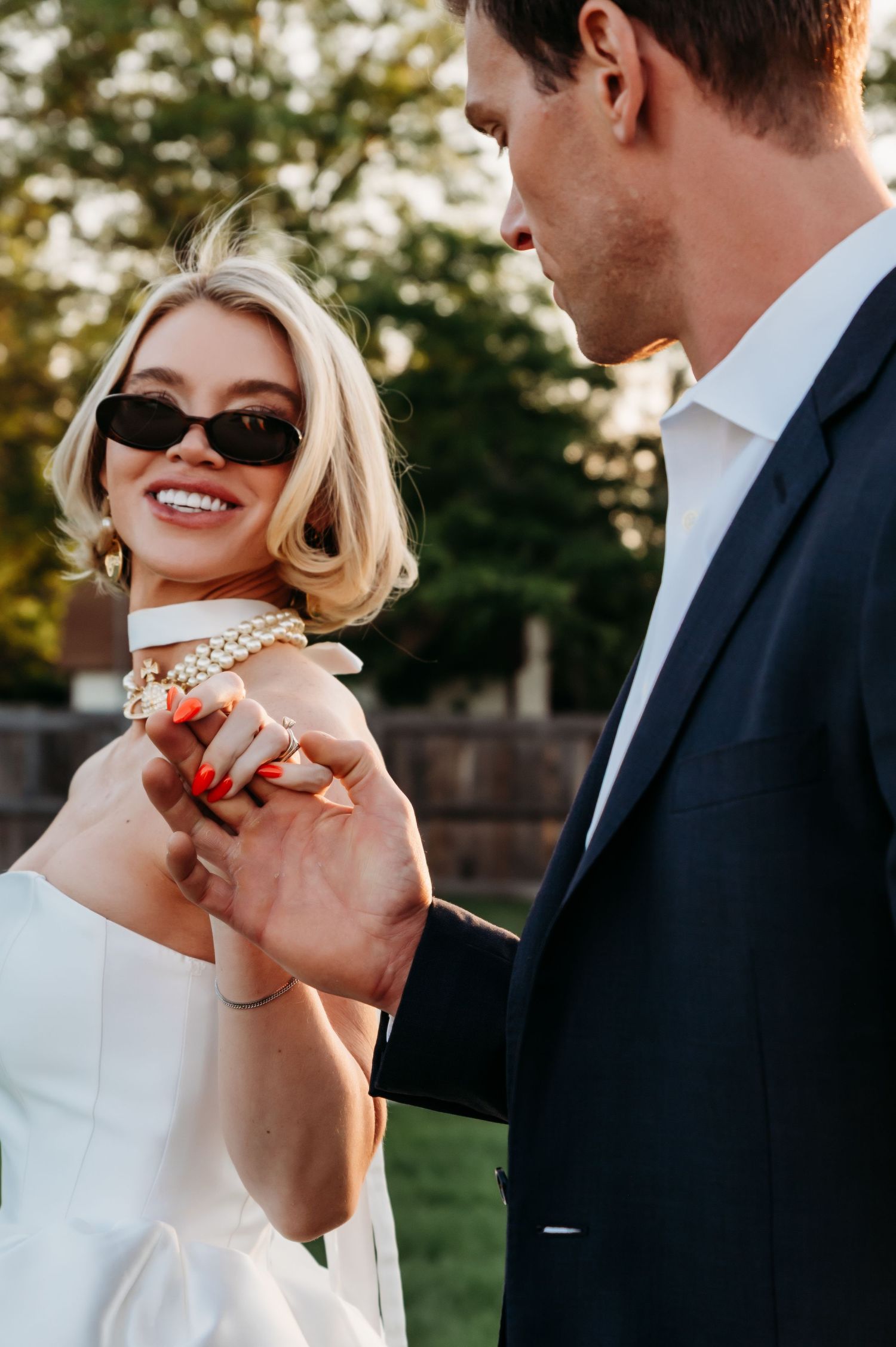 A romantic series of wedding photos showing a couple in formal attire sharing joyful moments together outdoors at sunset.