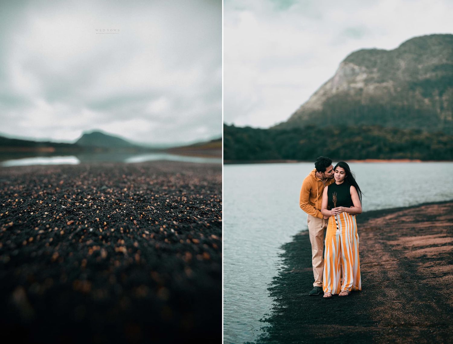 Romantic couple standing on dark shoreline with mountain lake and cloudy sky backdrop.