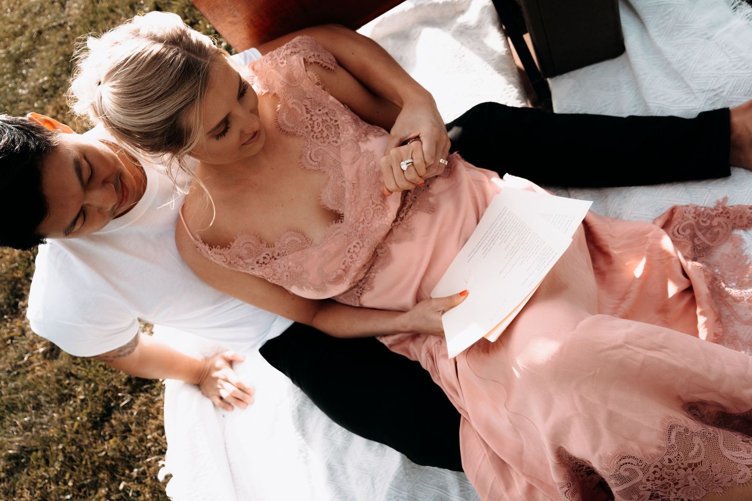 A romantic wedding couple shares tender moments in a series of intimate outdoor photographs.