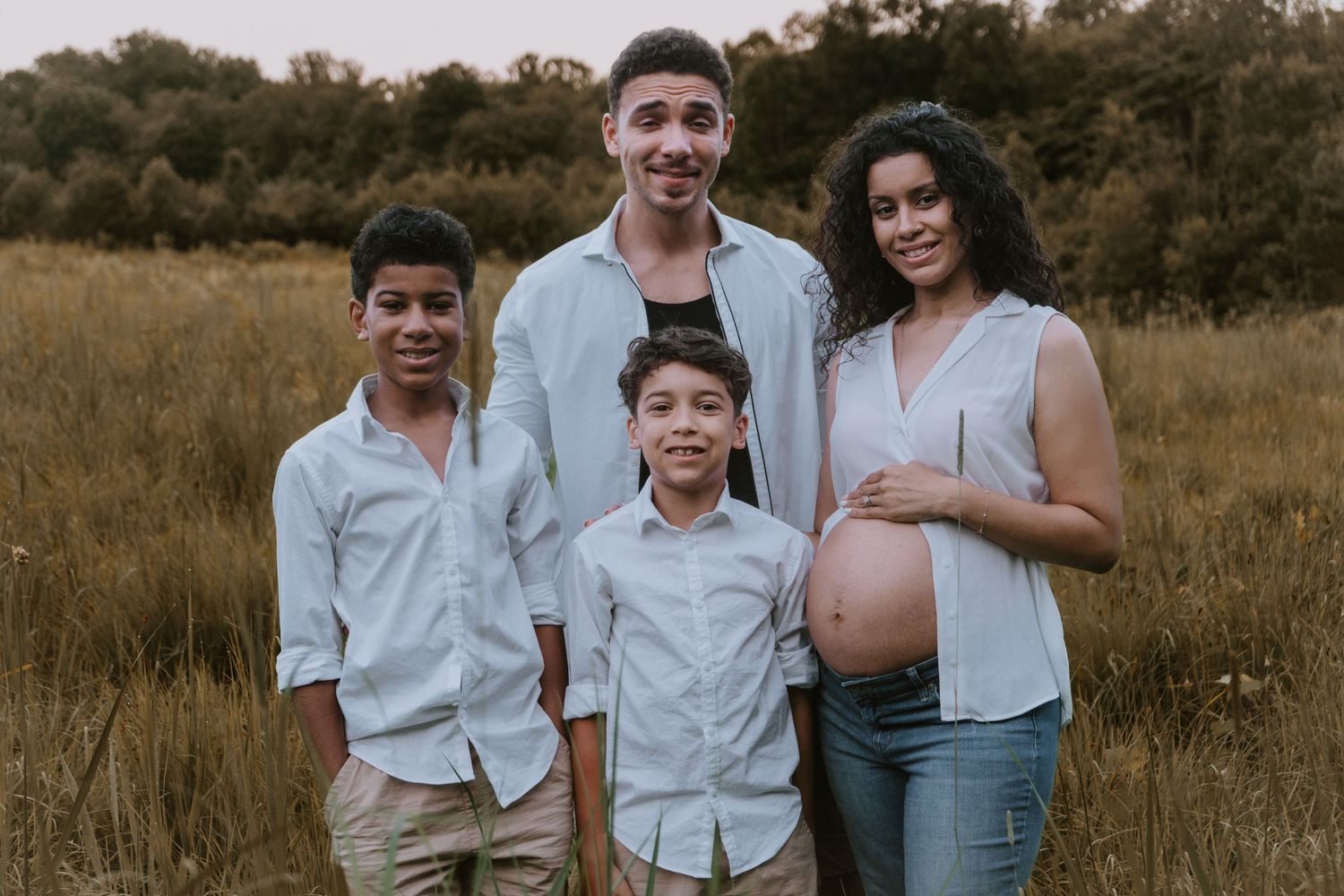 A series of artistic outdoor family portraits with people posed together in a natural field landscape at golden hour.