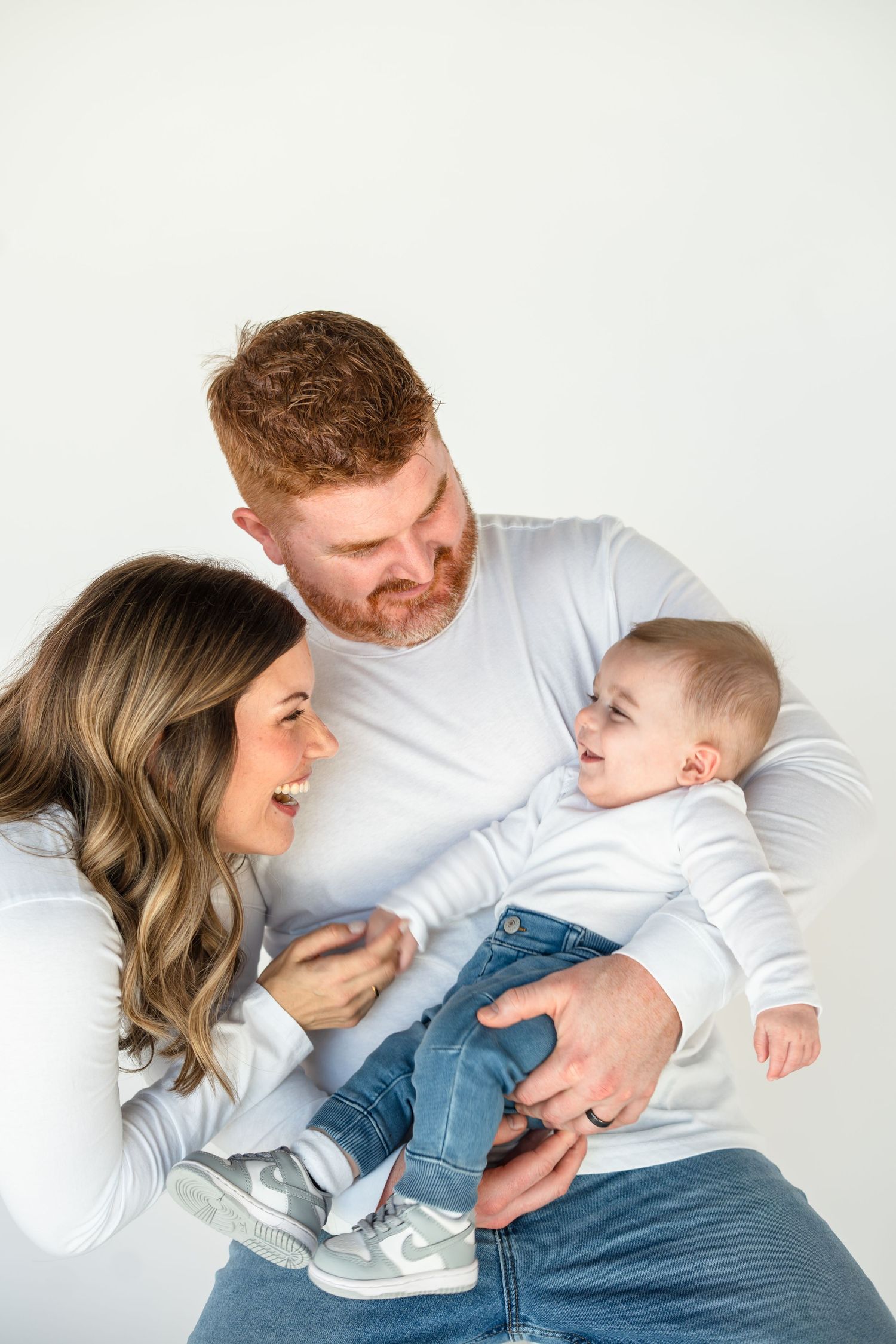 A heartwarming family moment captured in a series of playful interactions on a white background.