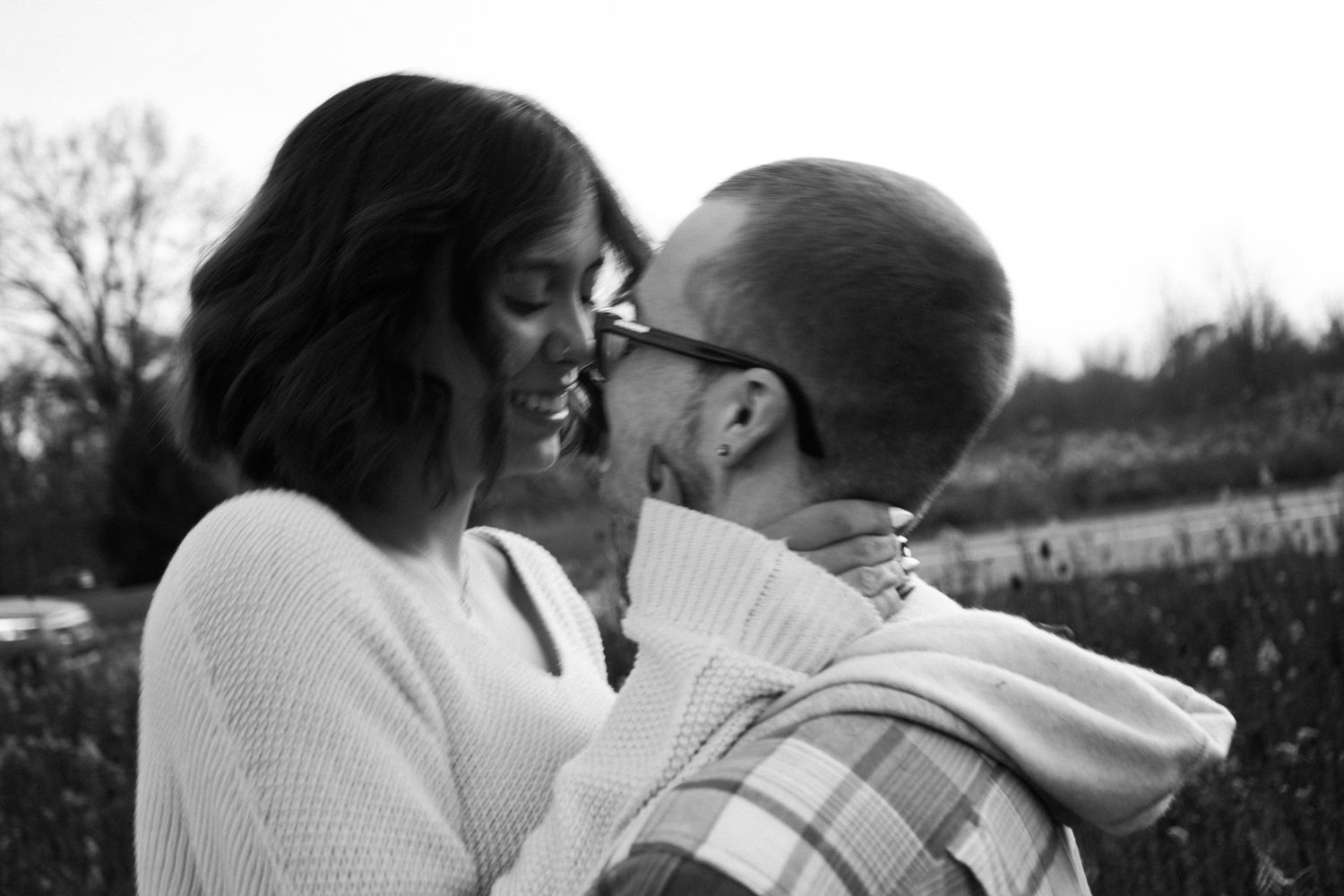 A black and white close-up of an intimate moment between two people.