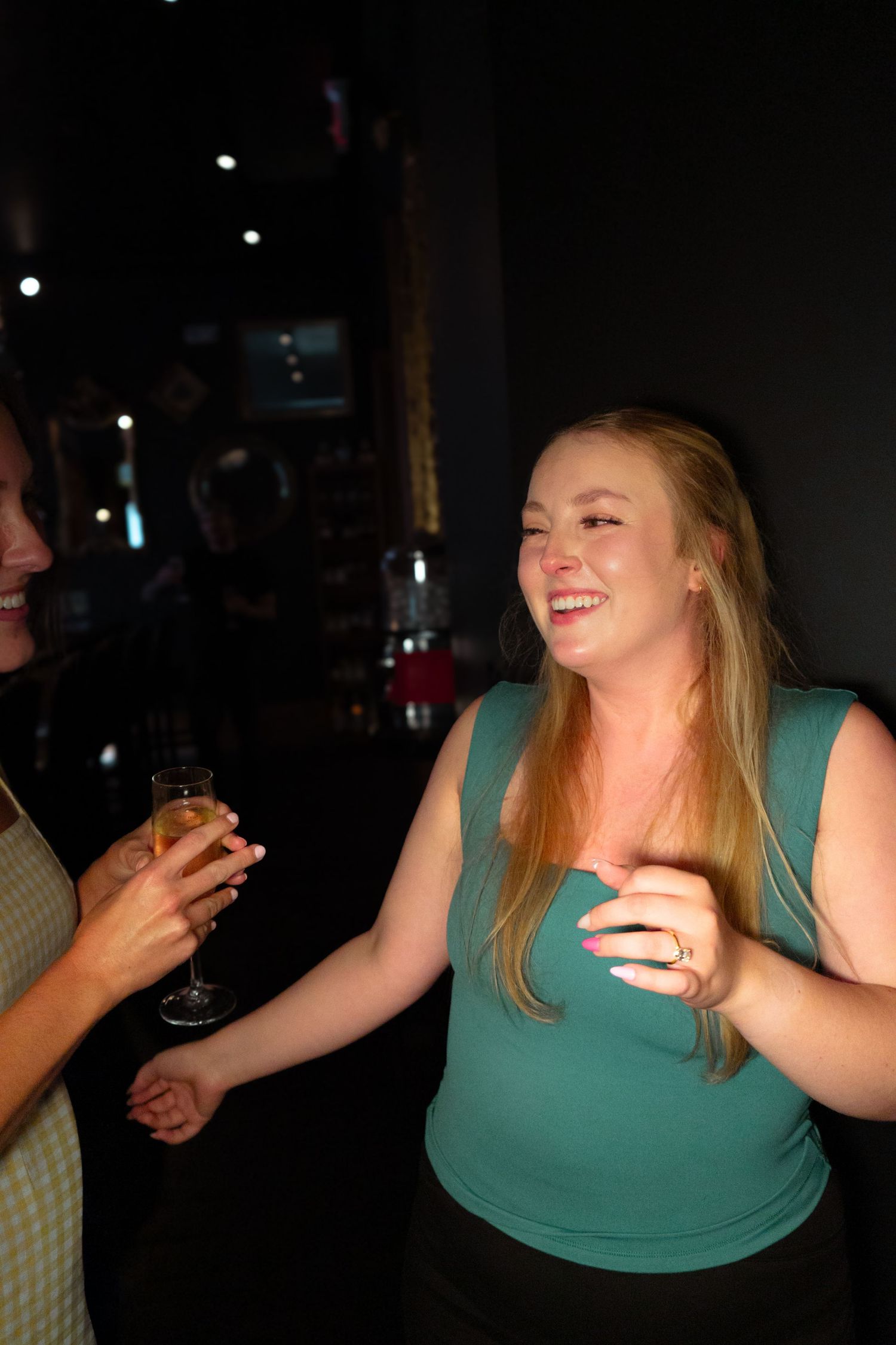 A sequence of photos shows a person in a teal tank top laughing and gesturing expressively in a dark setting.