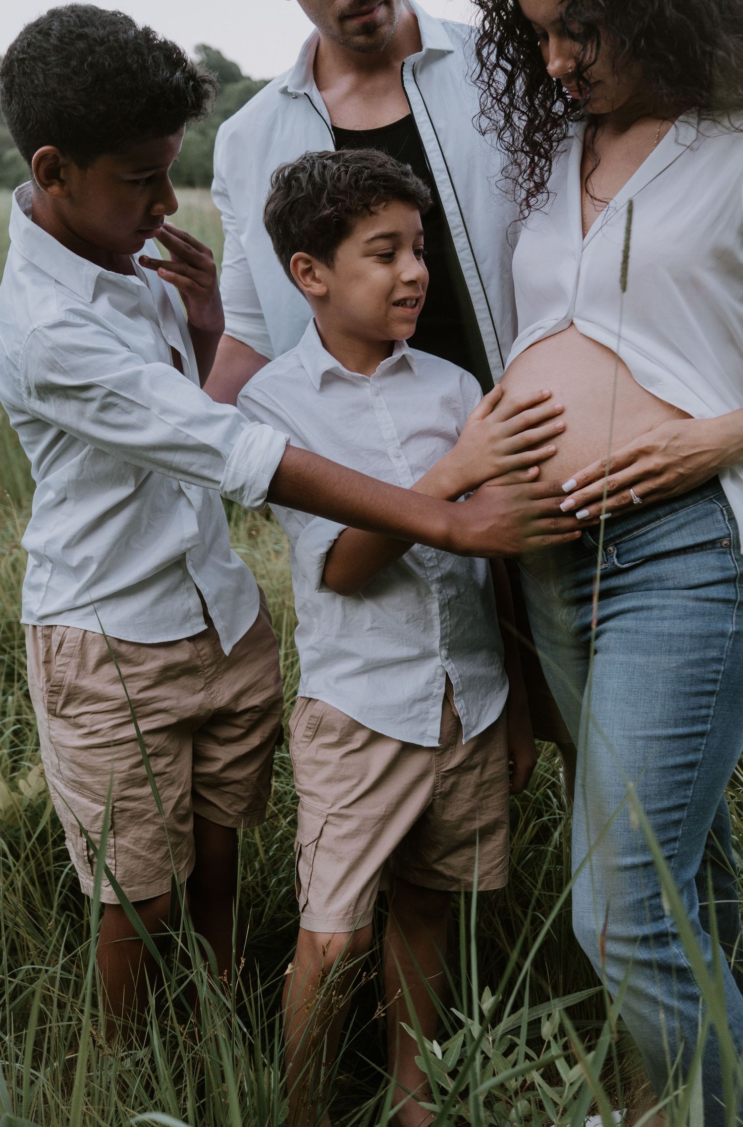 Side-by-side outdoor photos showing pregnancy maternity portraits with a child in white shirt and khaki pants in tall grass.