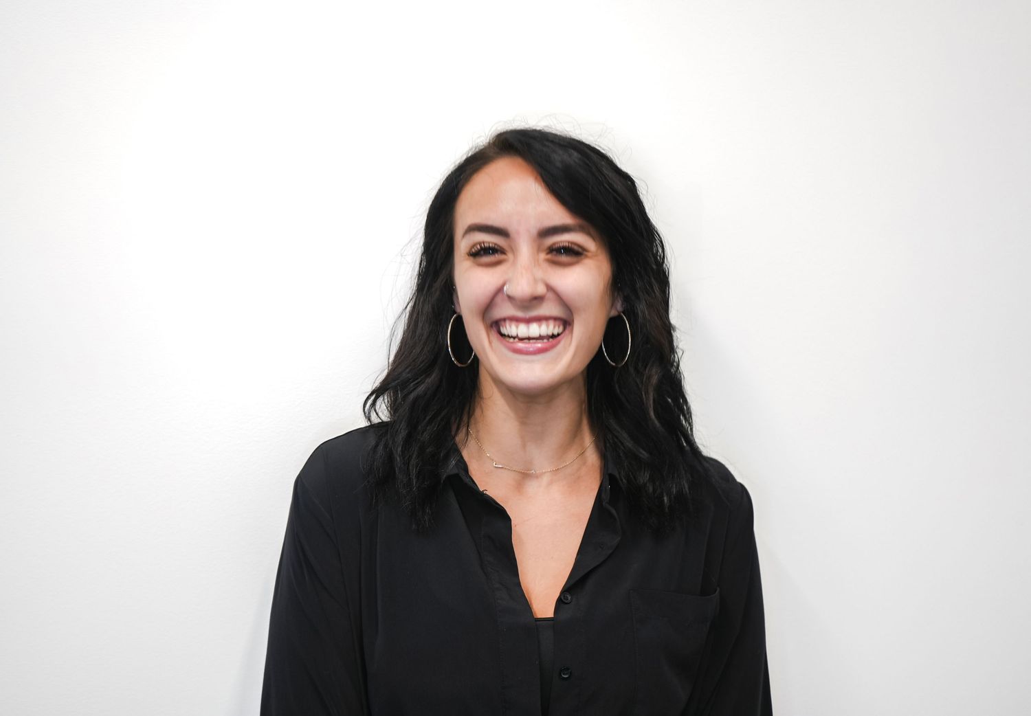 Professional headshots of someone with dark hair and a bright smile against a white background.
