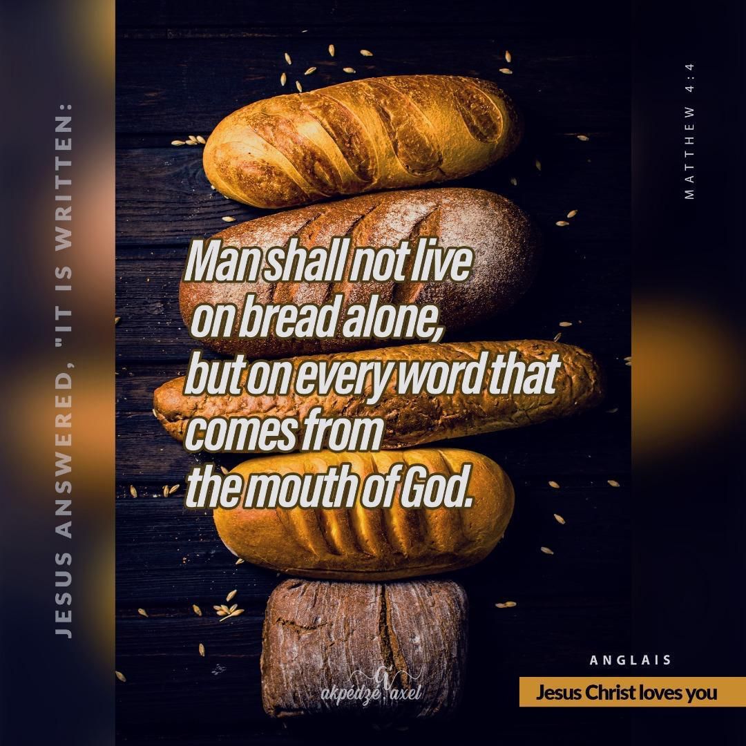 A rustic loaf of artisan bread sits atop a weathered dark wooden surface with text overlay in dramatic lighting.