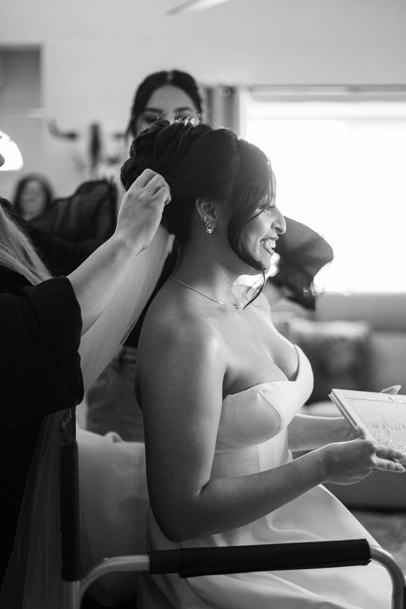 Black and white candid moments of wedding preparation and celebration.