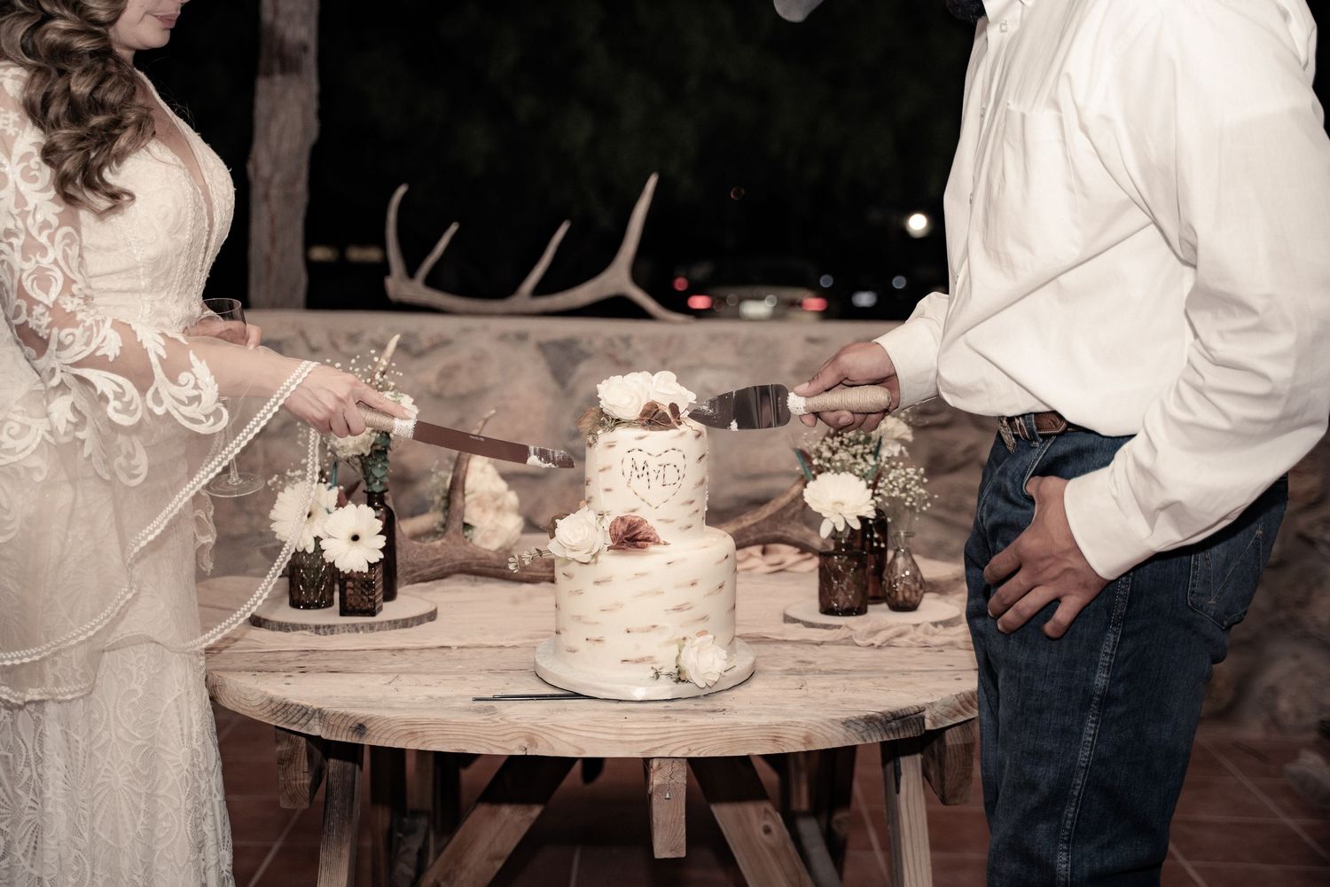 Wedding reception table settings feature elegant white linens, floral centerpieces and classic place settings.