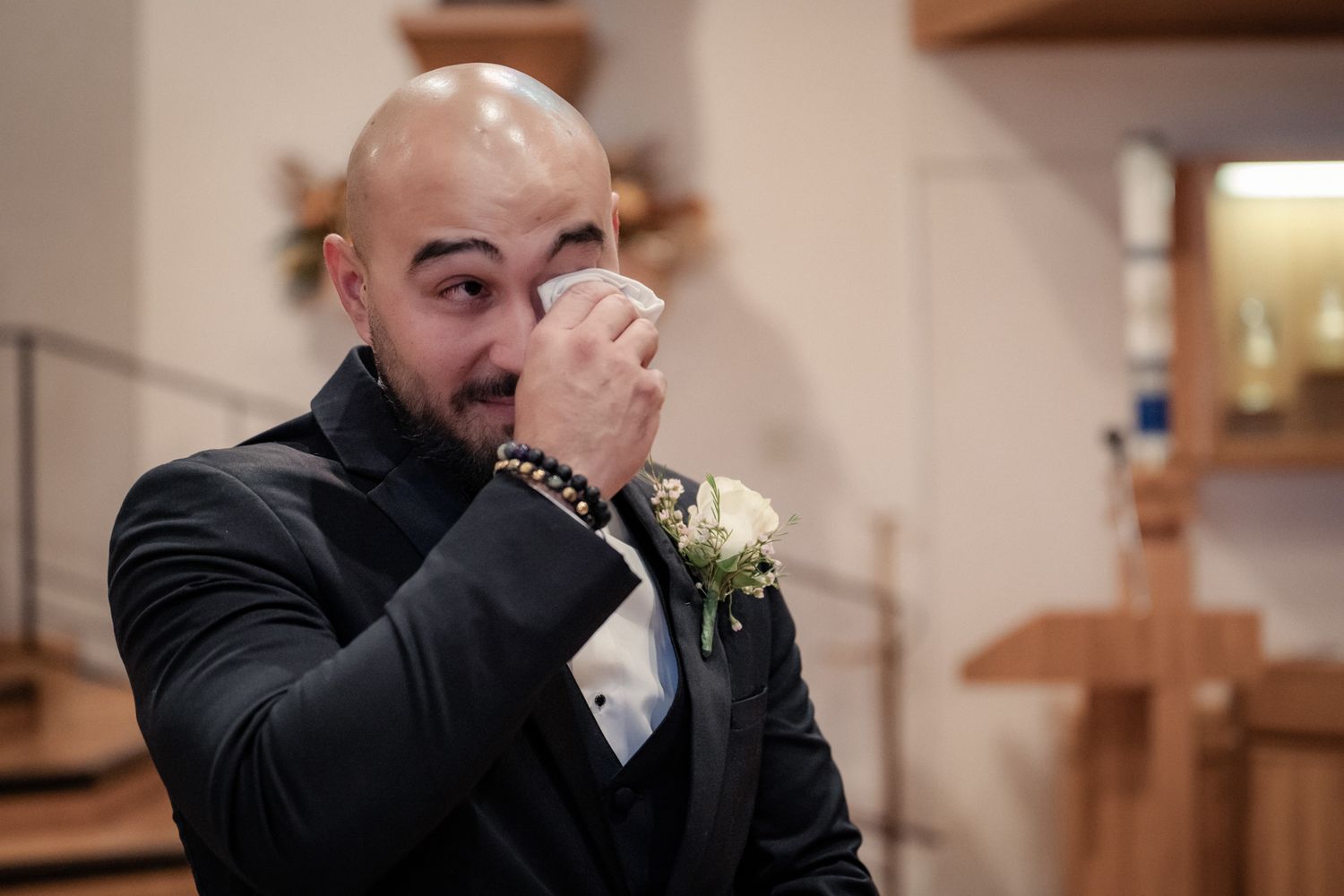 Emotional candid moments captured during a wedding ceremony in a church.