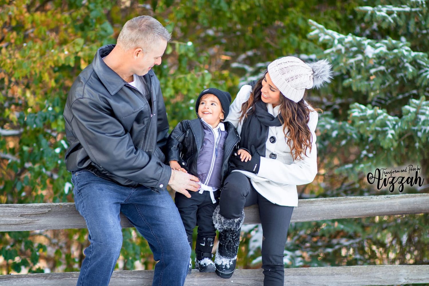 Family having playful moment together on outdoor bench during autumn season.
