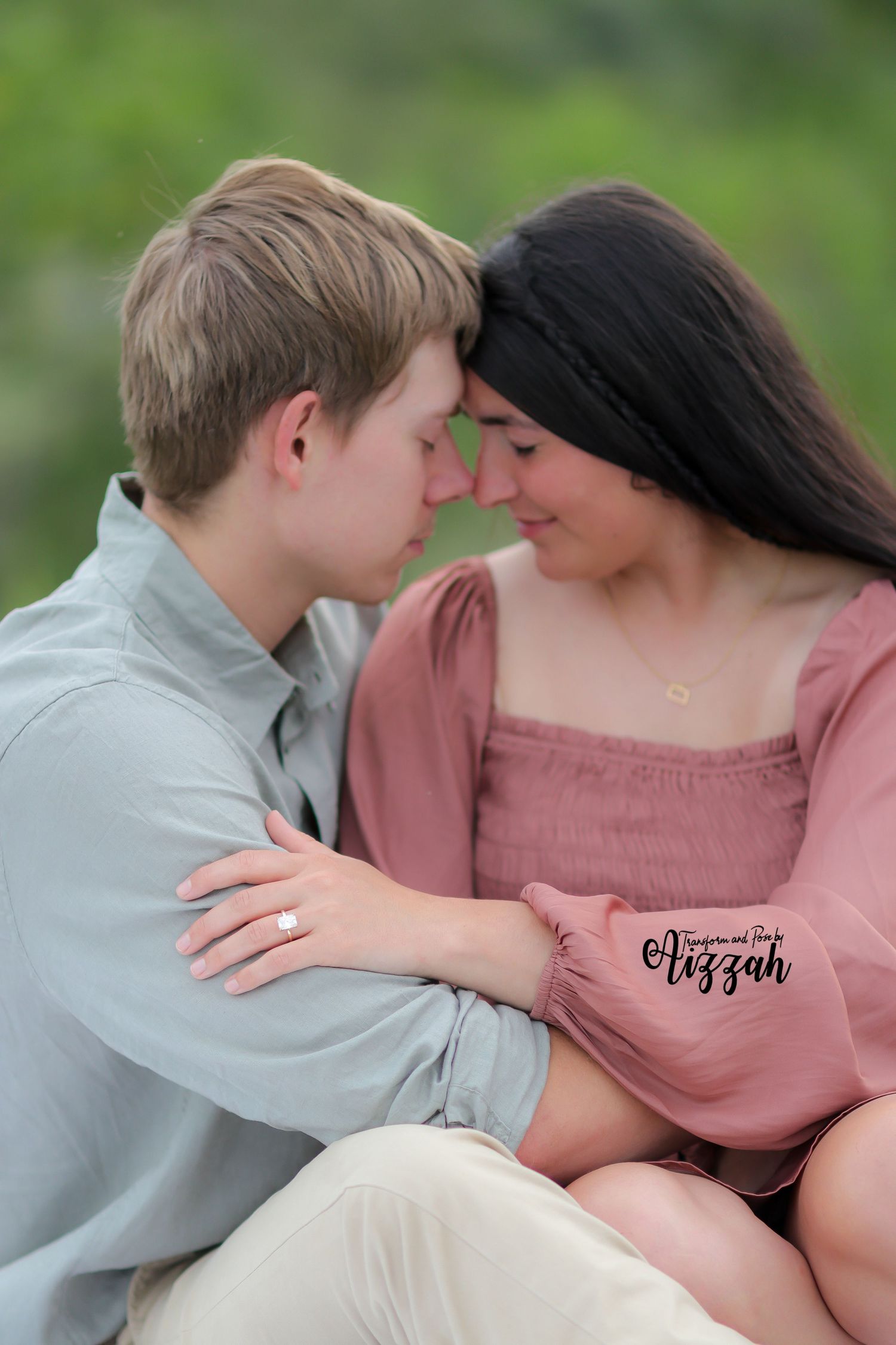 Intimate portrait of couple touching foreheads in soft natural lighting.