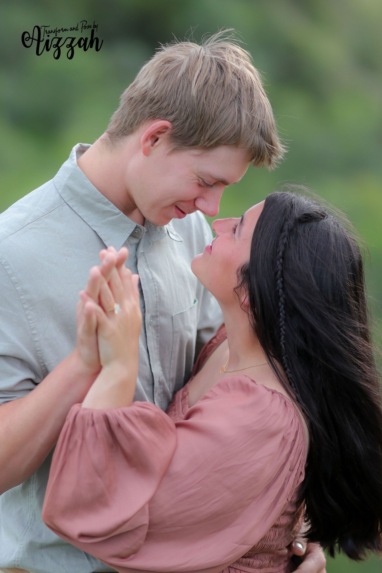 Intimate portrait of couple laughing together outdoors in casual attire.