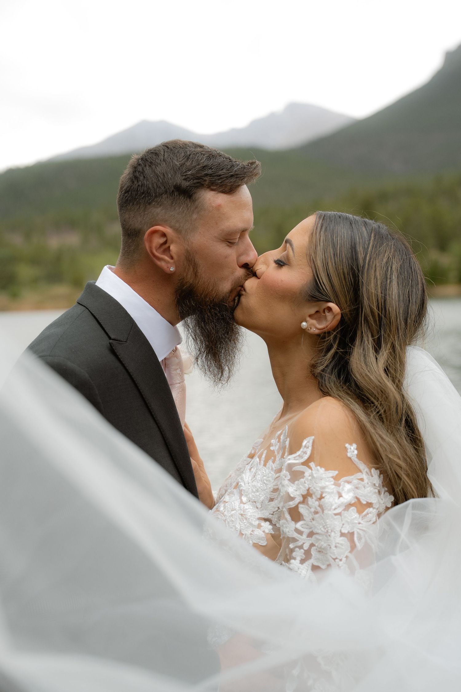 Bride and groom in Estes Park, Colorado wedding photographed by Jensen Photo & Film