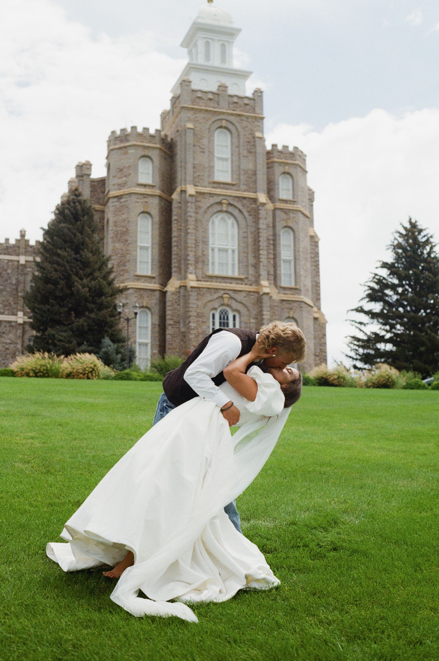 Bride and groom at Logan Temple, Utah wedding photography by Jensen Photo & Film. Utah wedding film photography