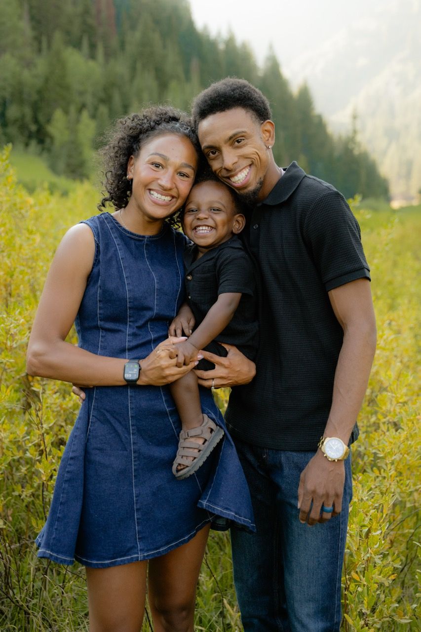 Small family posed for a photo in Utah mountains