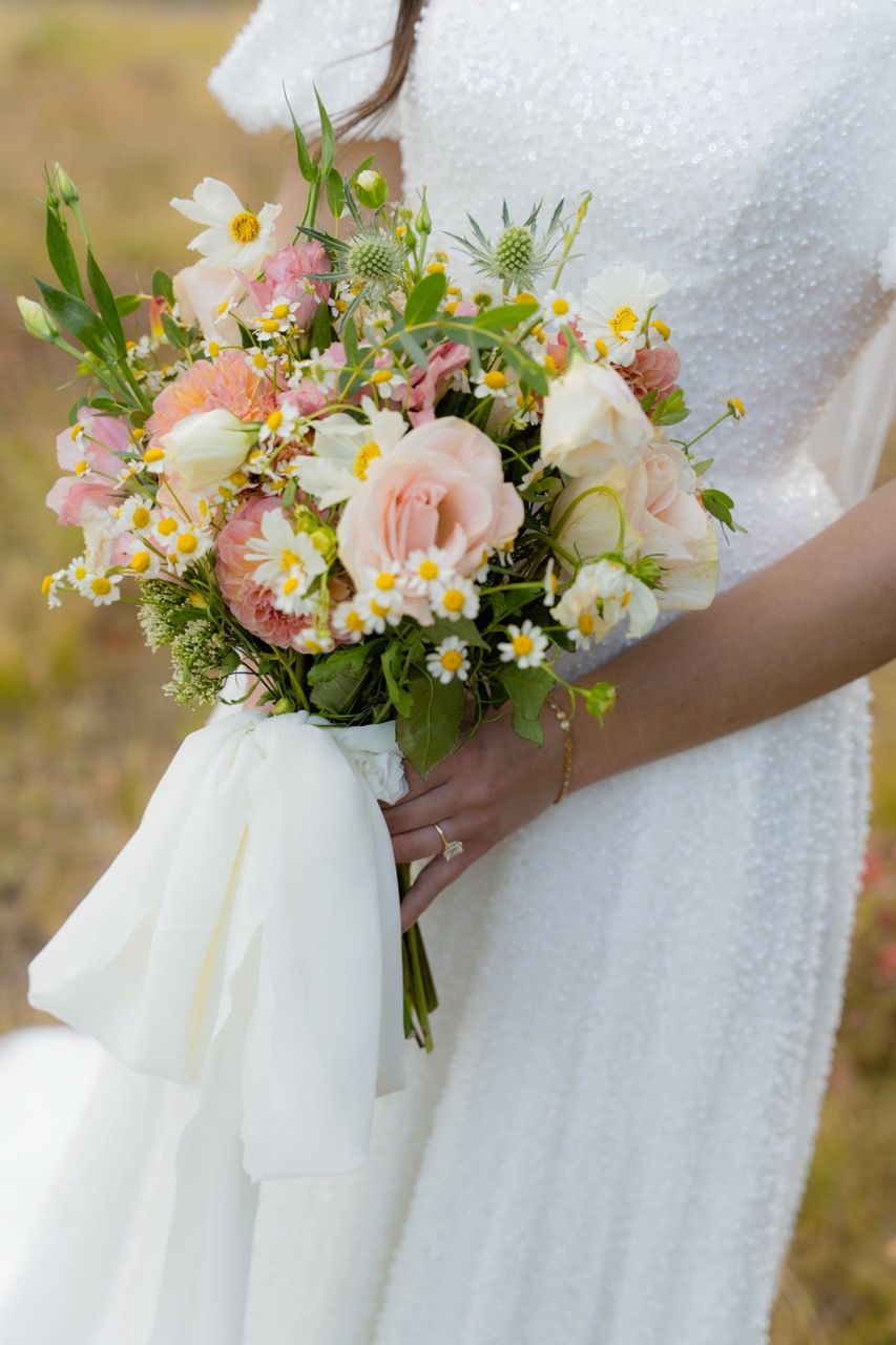 Bride holding wedding bouquet in Park City, Utah wedding photographed by Jensen Photo & Film