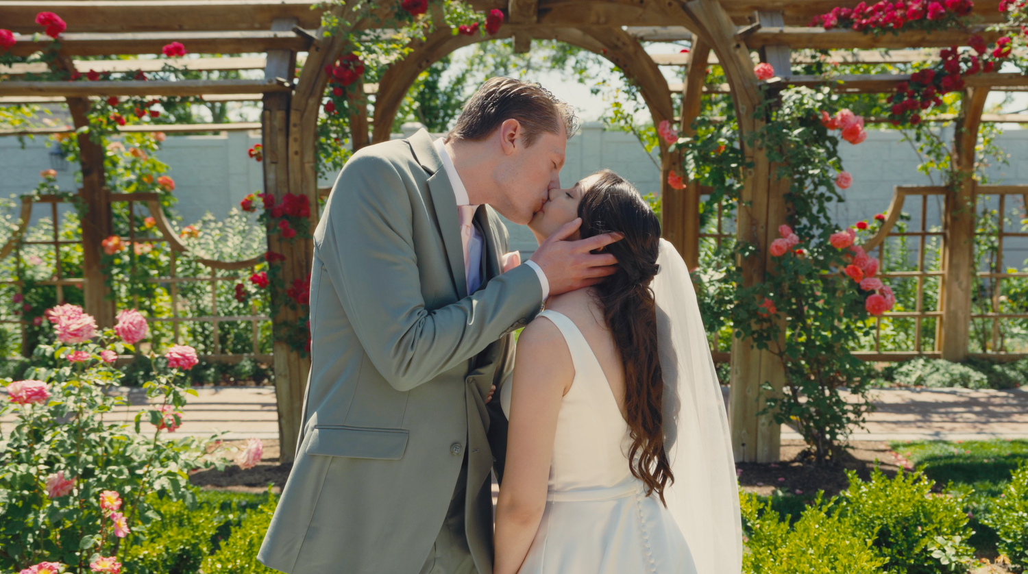 Bride and groom in Utah wedding videography by Jensen Photo & Film. Thanksgiving Point Rose Garden floral wedding.