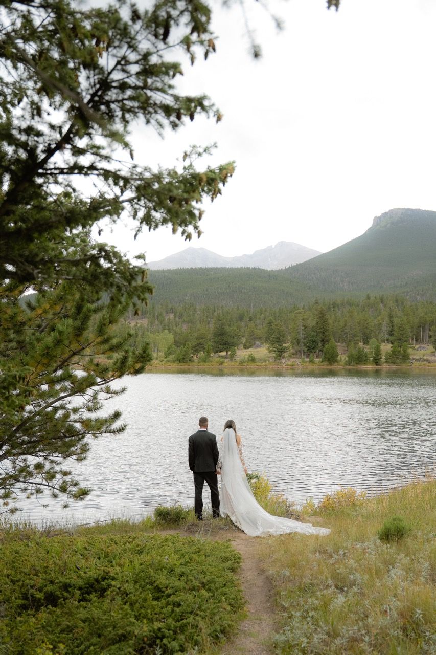 Bride and groom in Estes Park, Colorado wedding photographed by Jensen Photo & Film