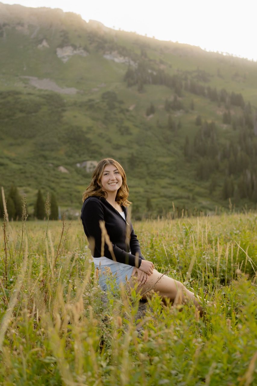 Utah senior photography at Albion Basin in Alta, Utah. Wildflowers and mountain backdrop photographed by Jensen Photo & Film.