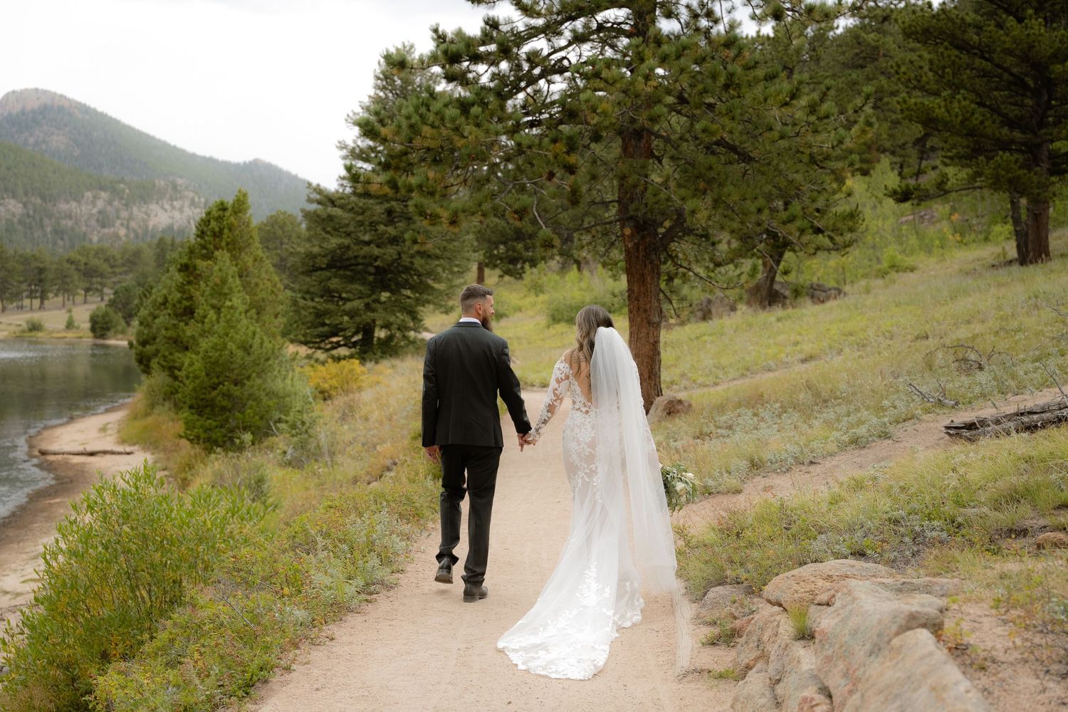 Bride and groom in Estes Park, Colorado wedding photographed by Jensen Photo & Film