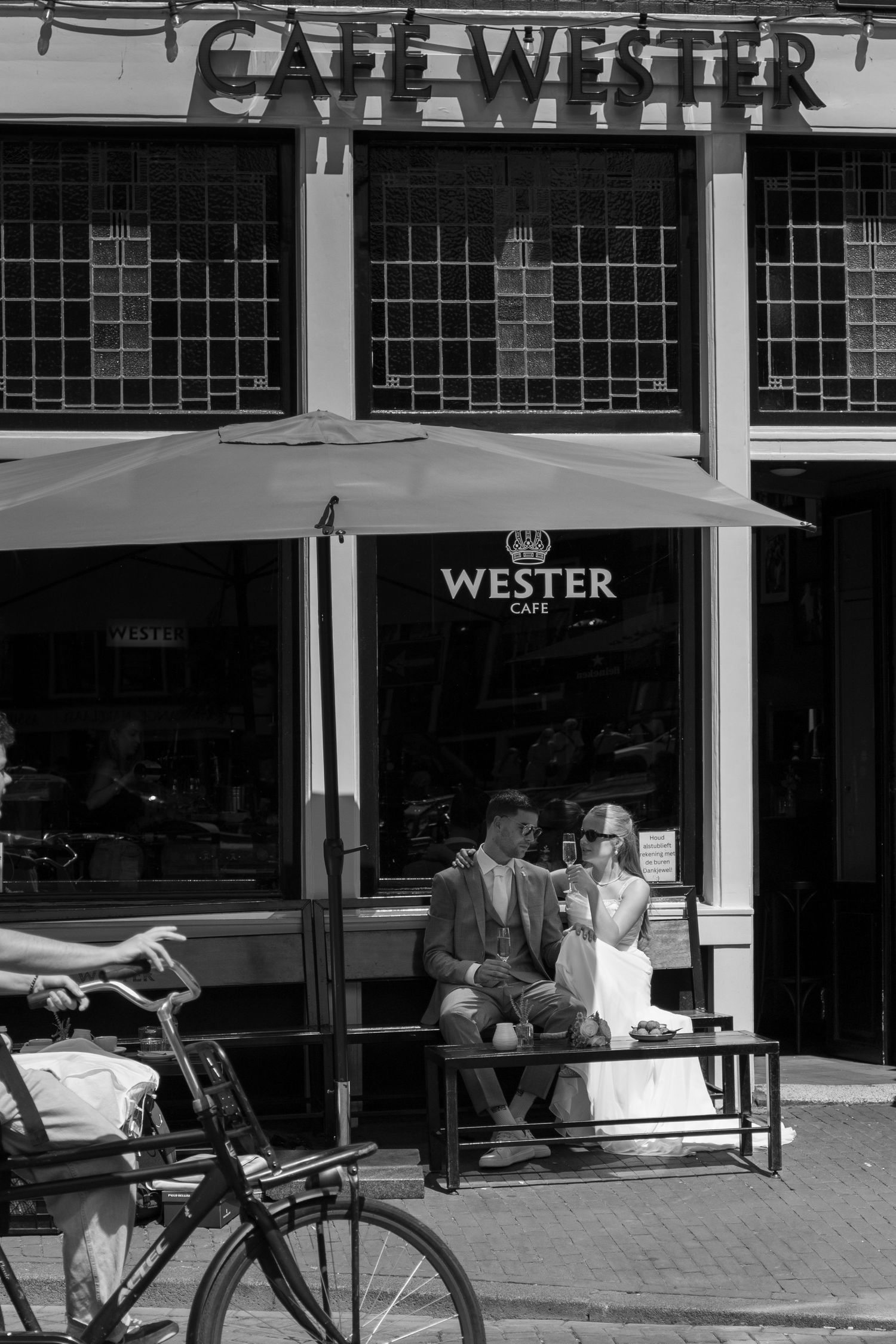 Exterior of a cafe called Wester with outdoor seating visible on a city street.