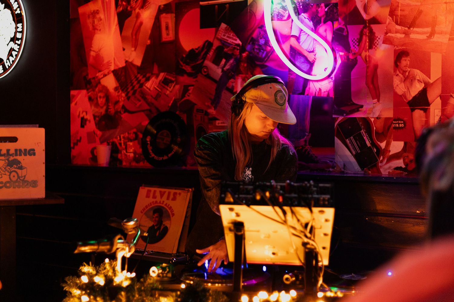 Nightclub interior with neon purple and red lighting creating atmospheric ambiance.