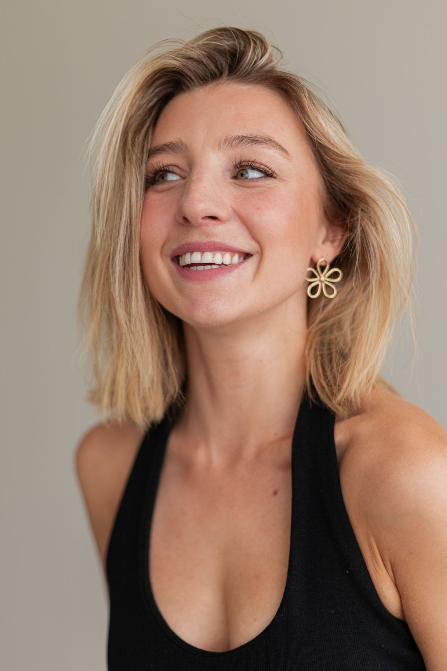 Series of expressive portrait shots showing joyful smiles and blonde hair against neutral background.