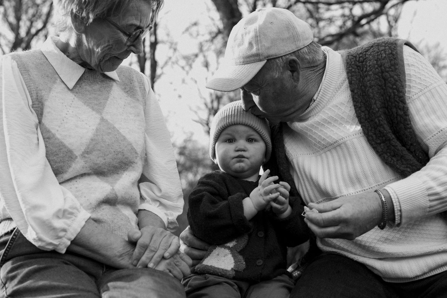 A black and white photo collage shows people in casual settings sharing tender moments together.