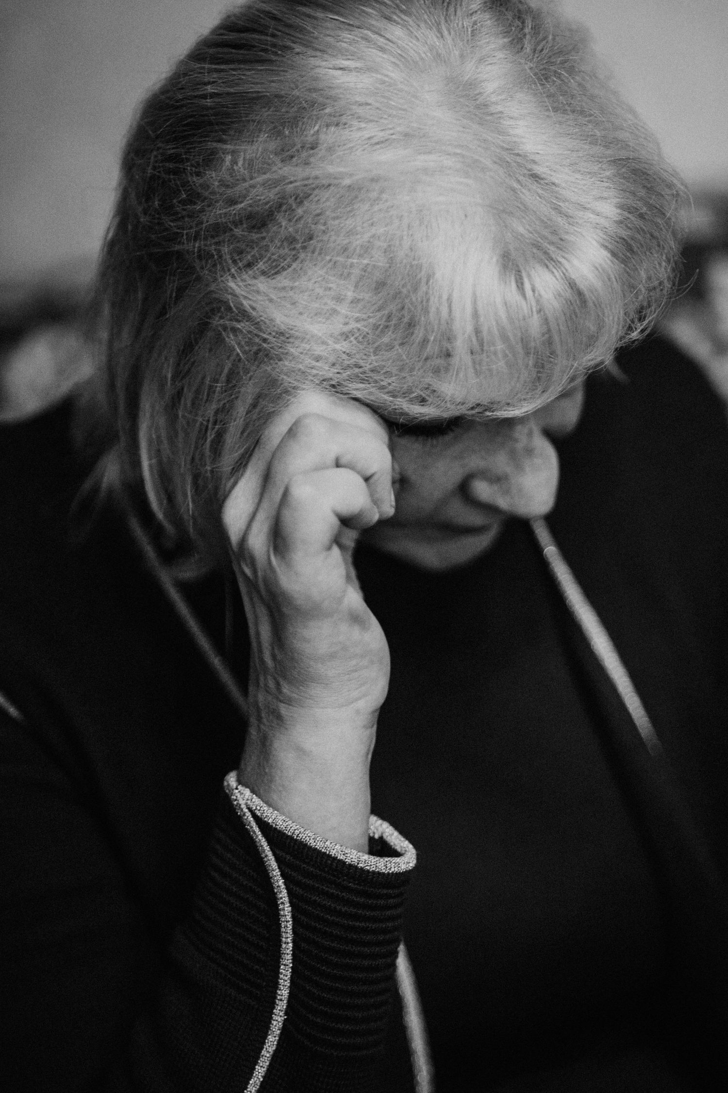Black and white portrait series showing dramatic side profile lighting and jewelry details.