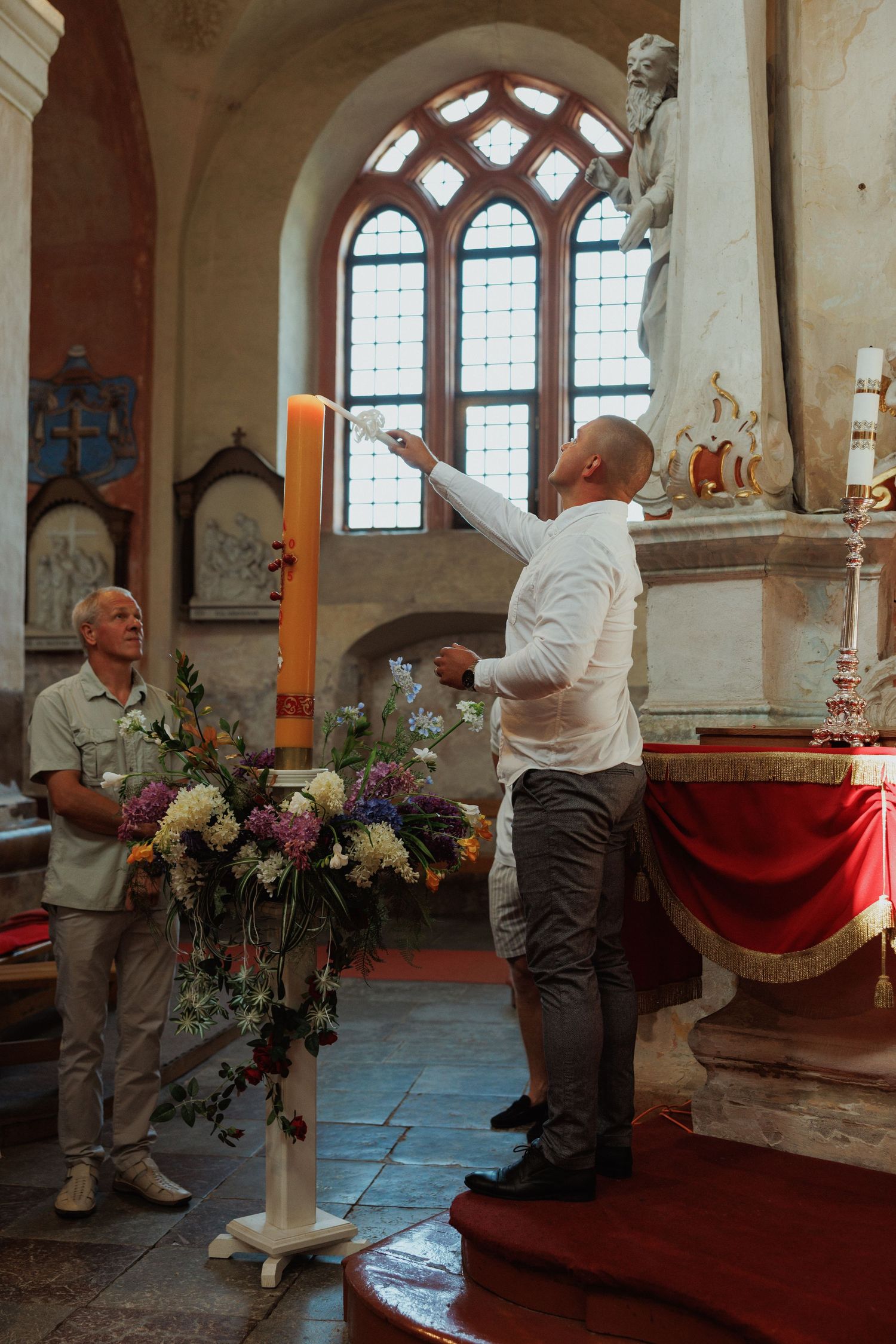 A collage of scenes inside a church showing people decorating with floral arrangements and preparing the altar area.