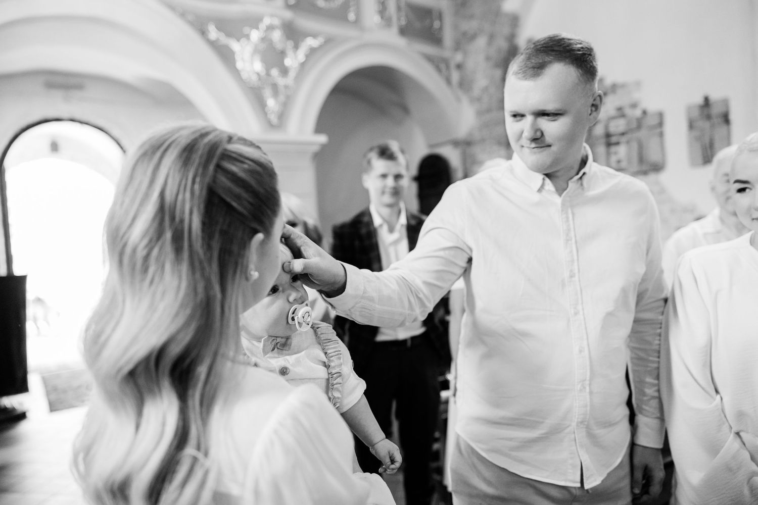 Black and white photos capturing candid moments during a formal celebration.