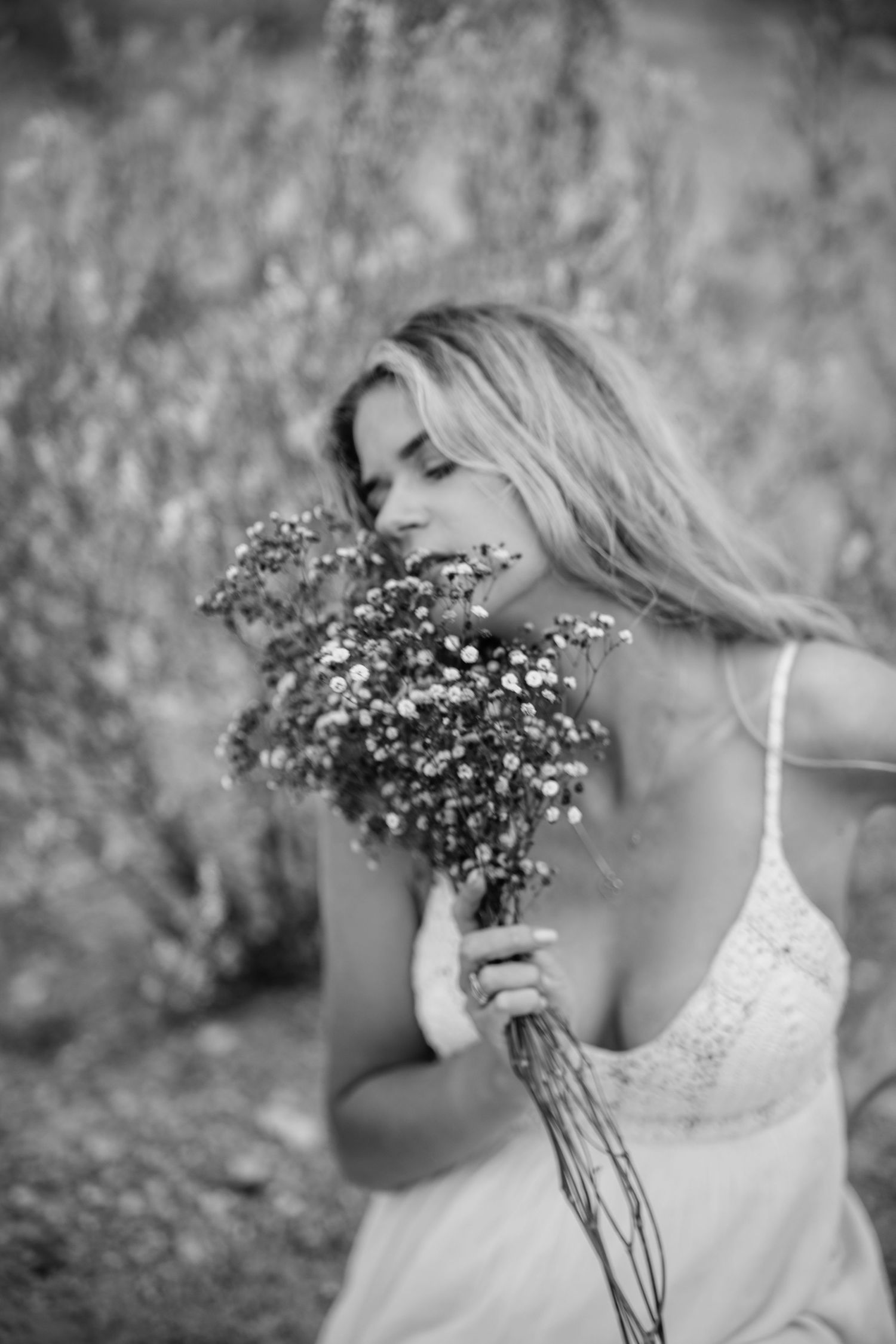 Black and white photo series with baby's breath flowers creating a romantic ethereal effect.