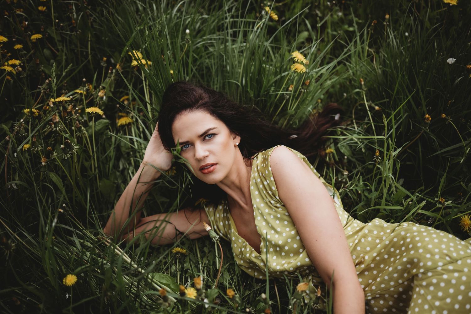 Artistic portrait series showing graceful poses among spring wildflowers.