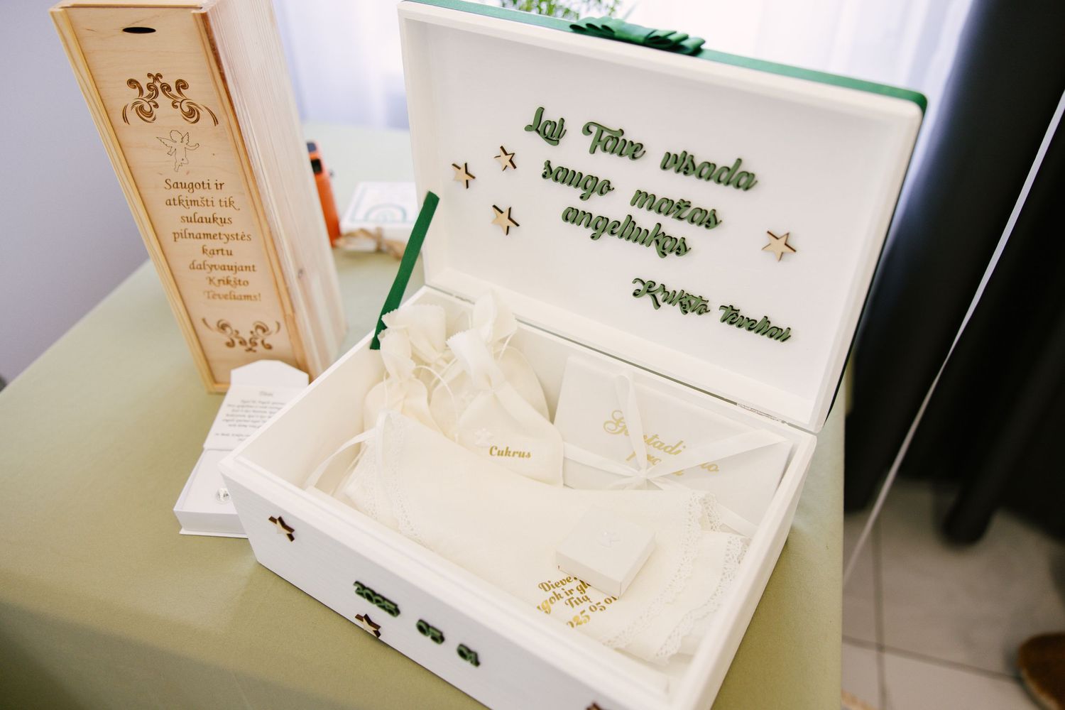 White guest book display with delicate floral designs and decorative elements.